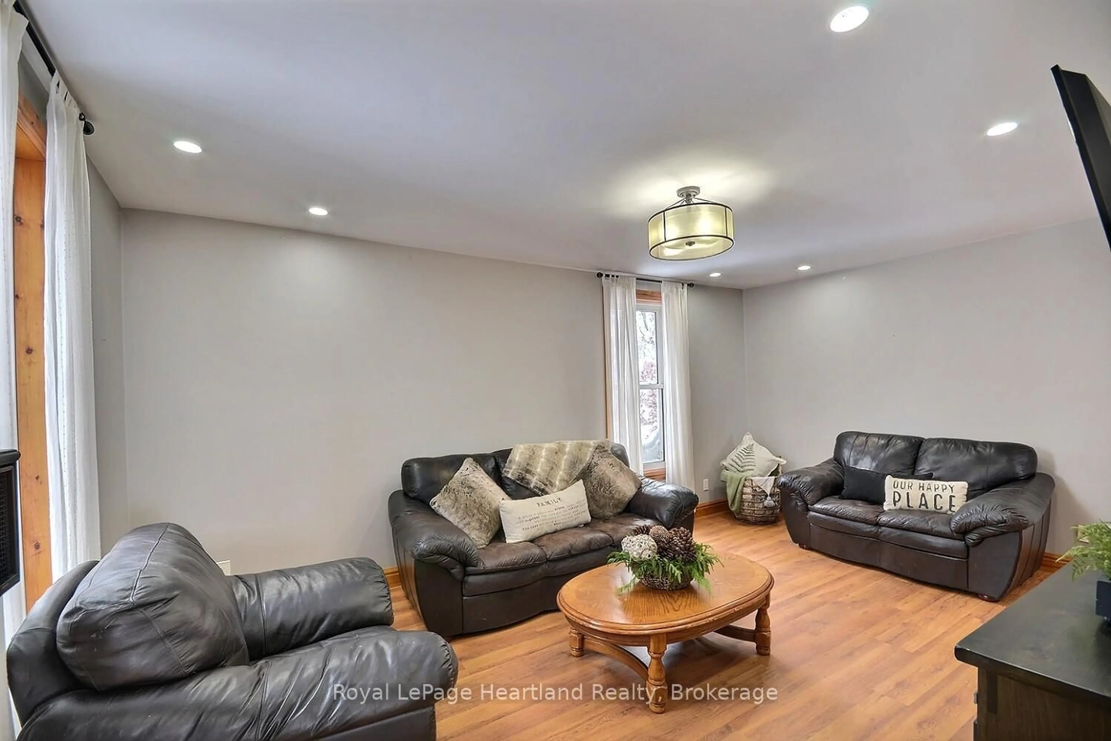 Living room with furniture, wood/laminate floor for 6985 Raglan St, West Perth Ontario N0K 1E0