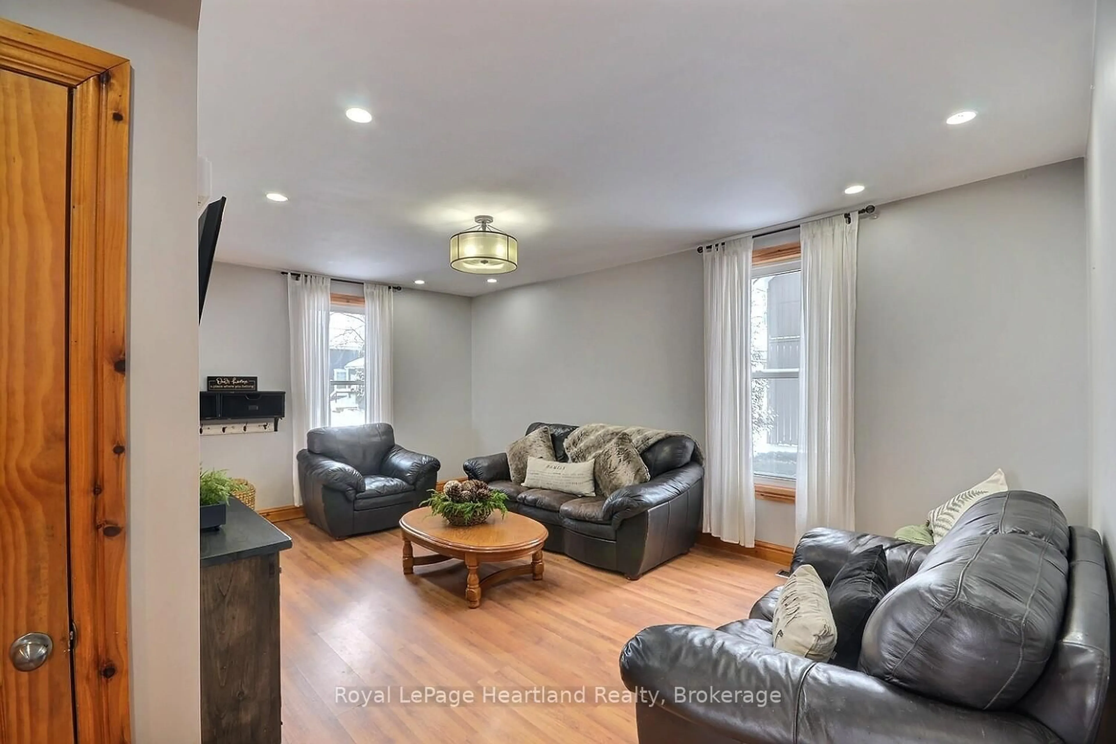 Living room with furniture, wood/laminate floor for 6985 Raglan St, West Perth Ontario N0K 1E0