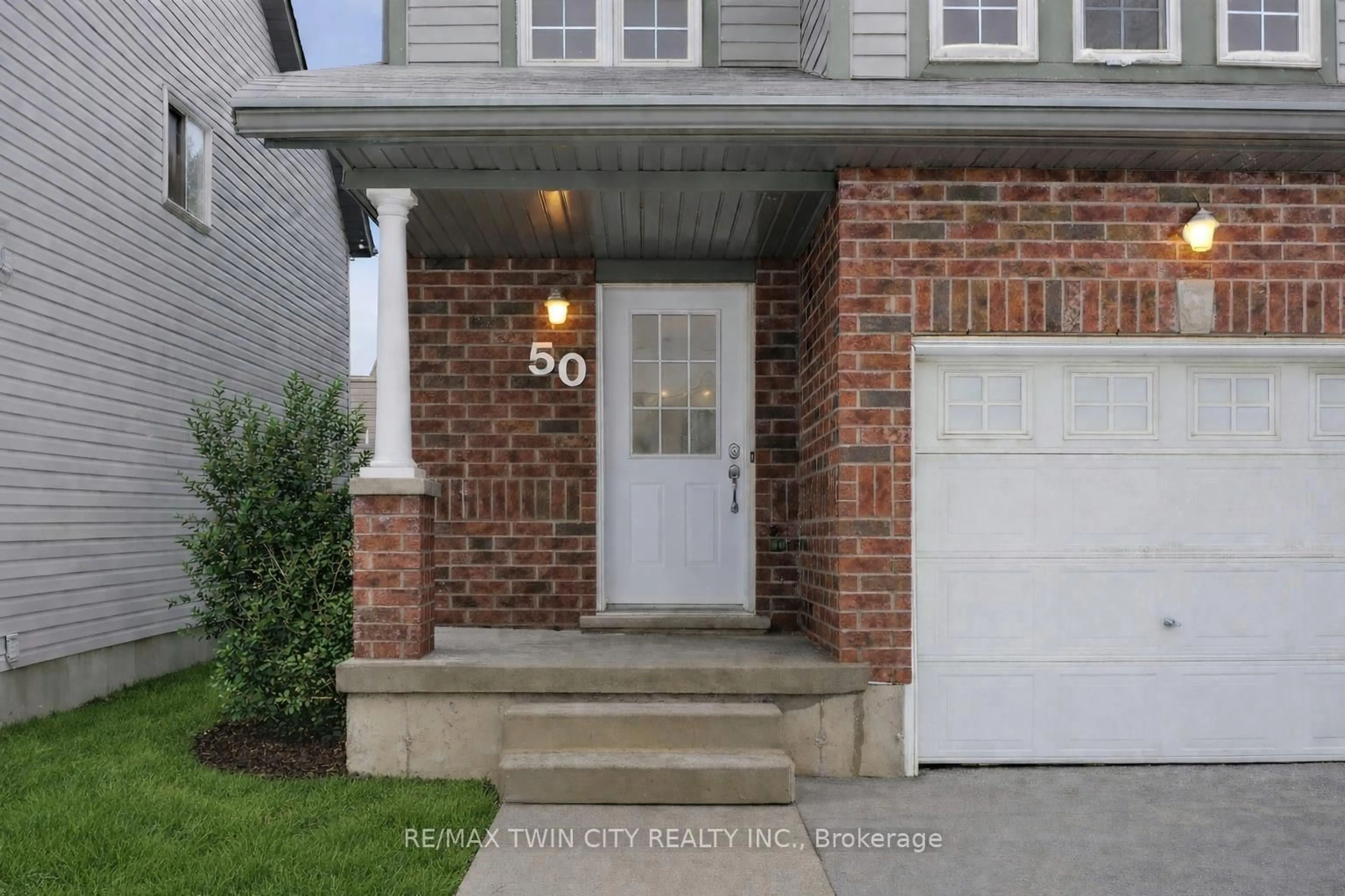 Home with brick exterior material, street for 50 Dahlia St, Kitchener Ontario N2E 4B1