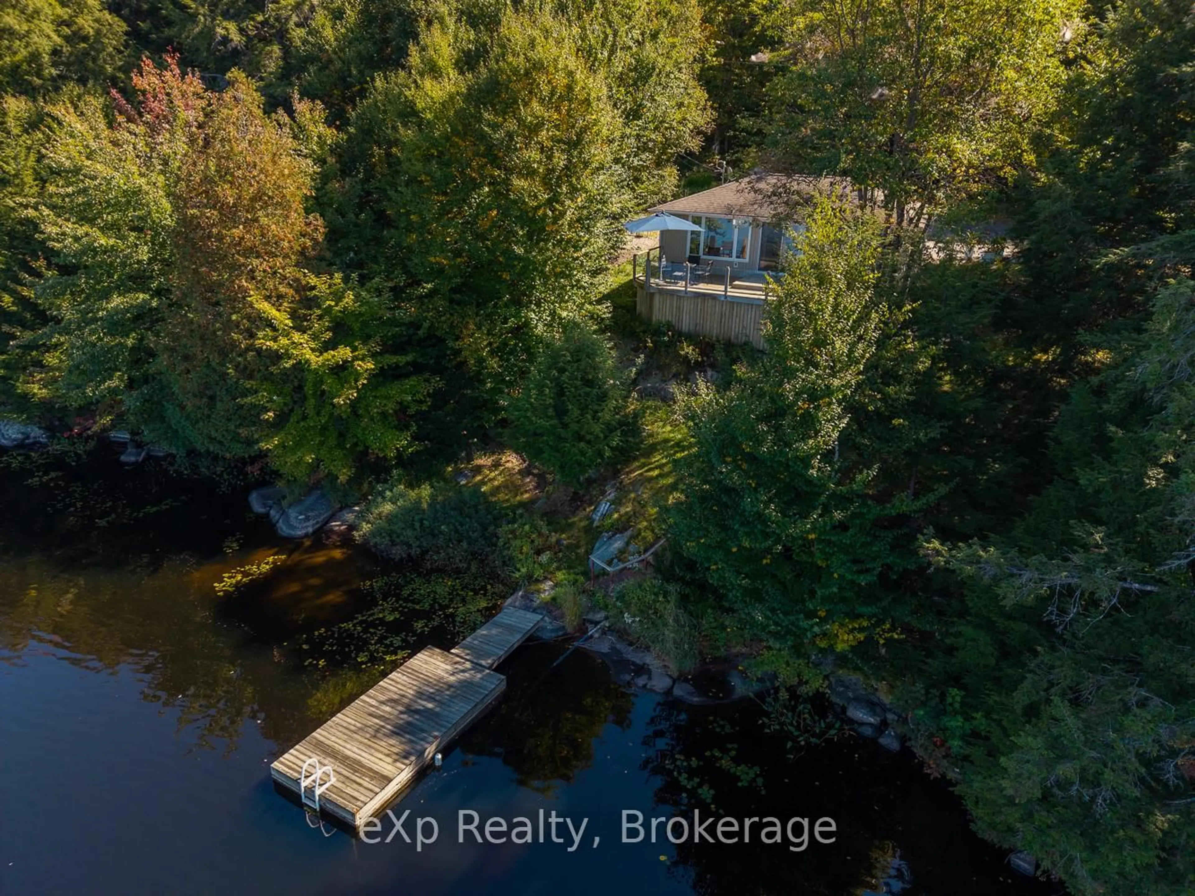 A pic from outside/outdoor area/front of a property/back of a property/a pic from drone, water/lake/river/ocean view for 4 Fire Route 140 (Turtle Lane) Lane, McKellar Ontario P0G 1C0