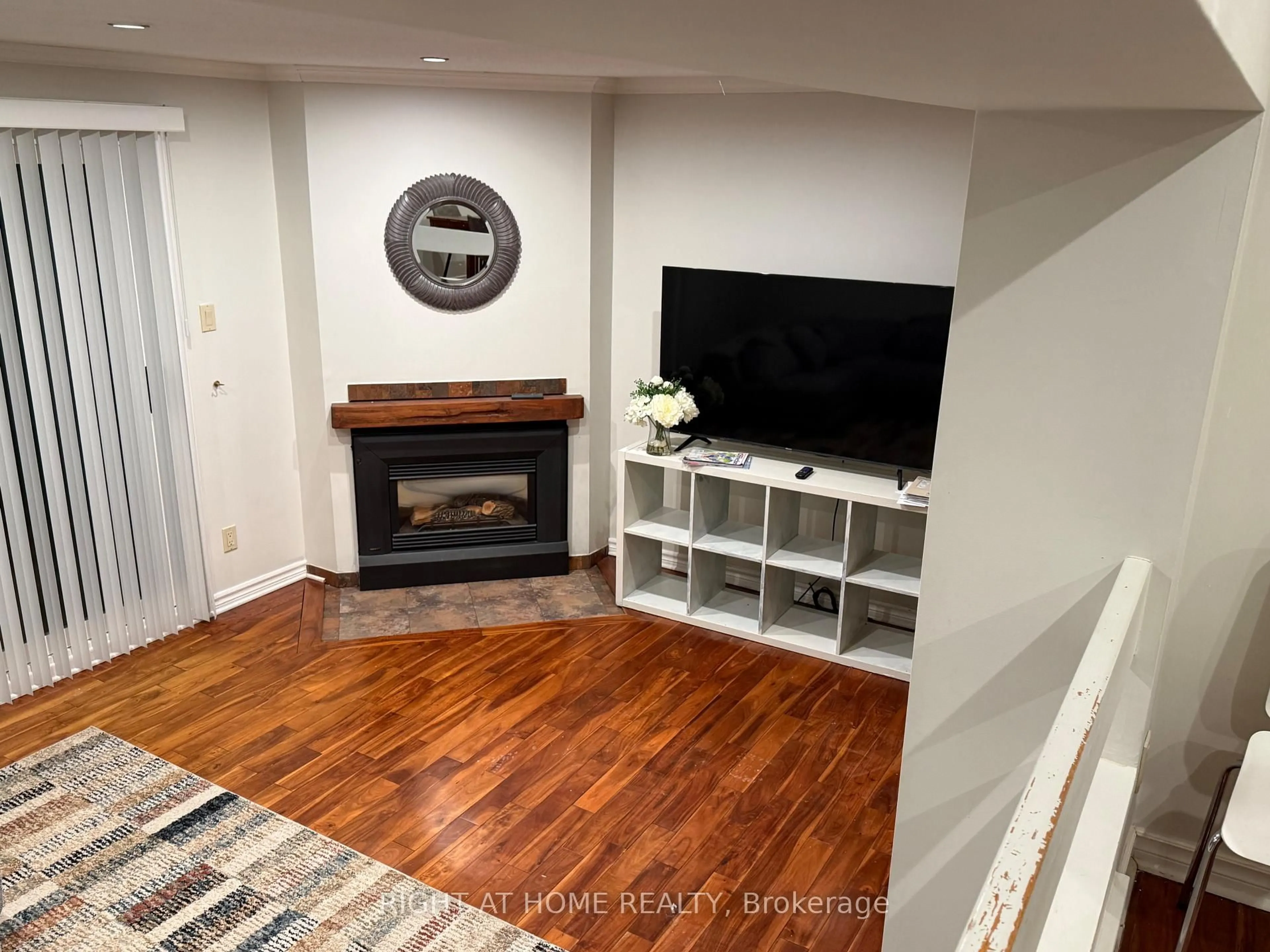Living room with furniture, wood/laminate floor for 1736 LAMOUREUX Dr #C, Ottawa Ontario K1E 2N5