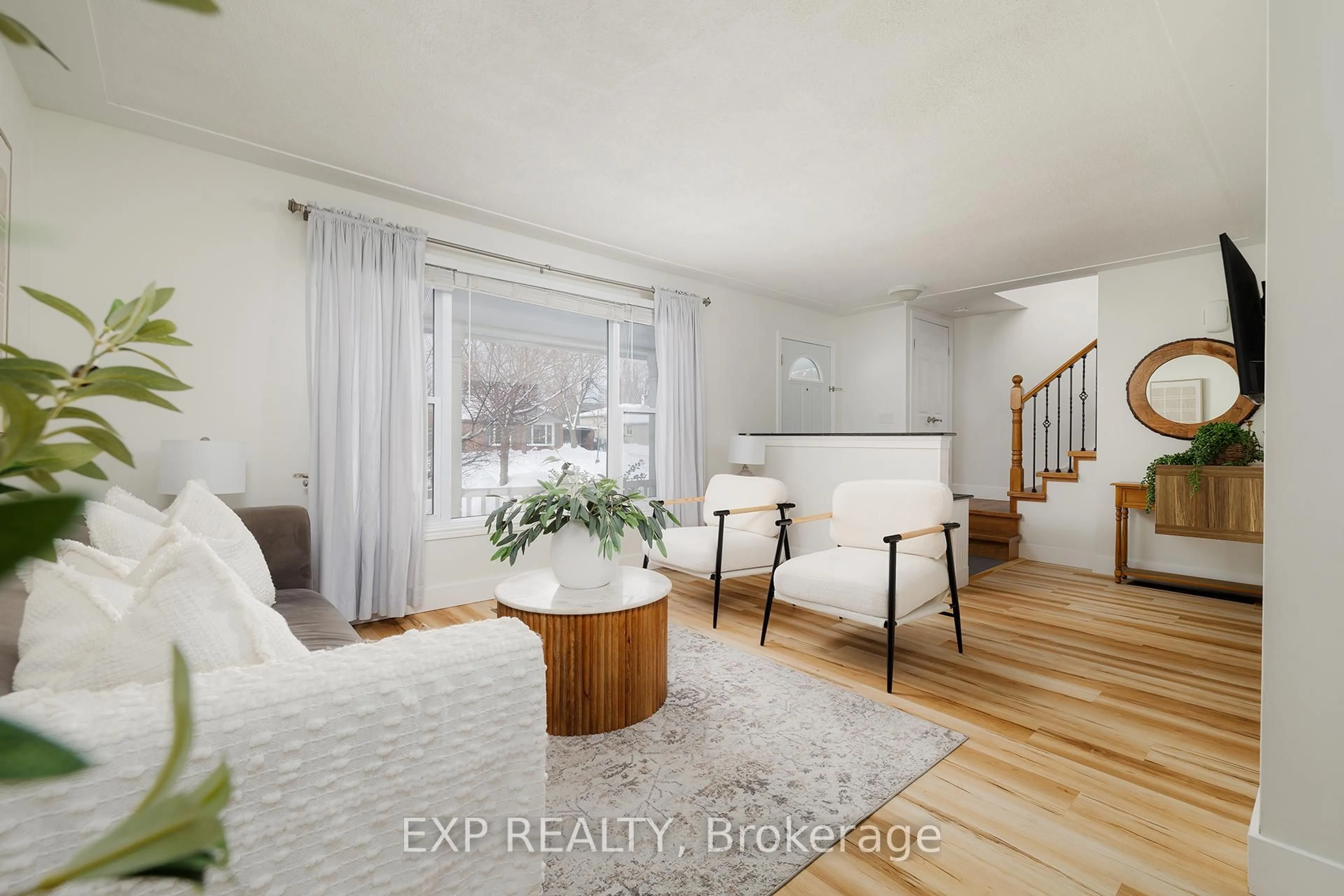 Living room with furniture, wood/laminate floor for 23 Dooley Dr, Kitchener Ontario N2A 1L5