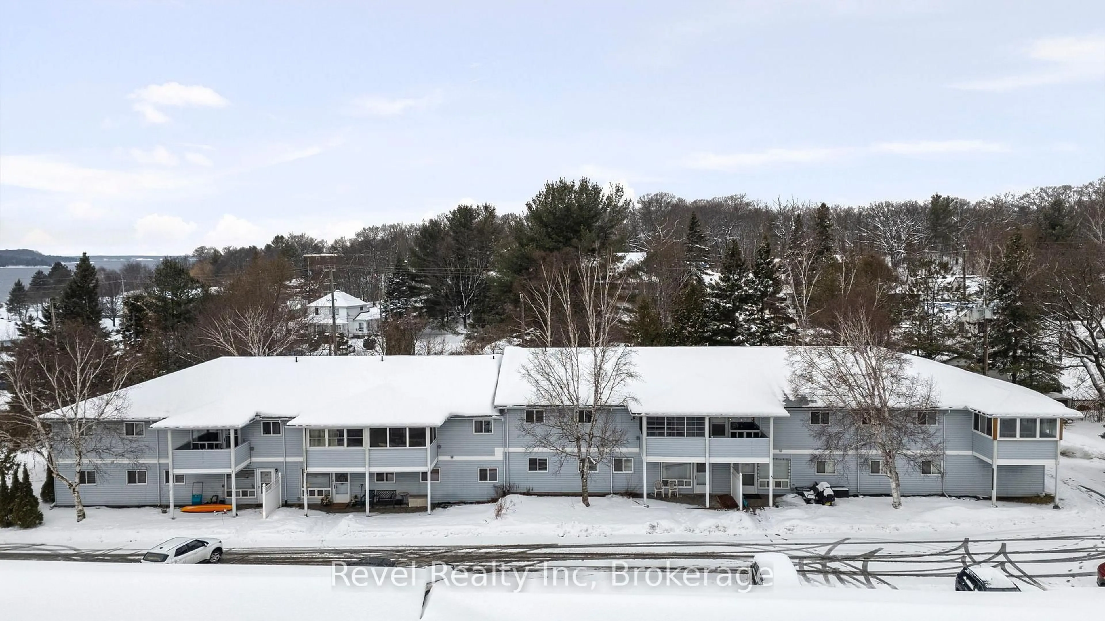 A pic from outside/outdoor area/front of a property/back of a property/a pic from drone, mountain view for 1 Georgian Bay Ave #206, Parry Sound Ontario P2A 3B1