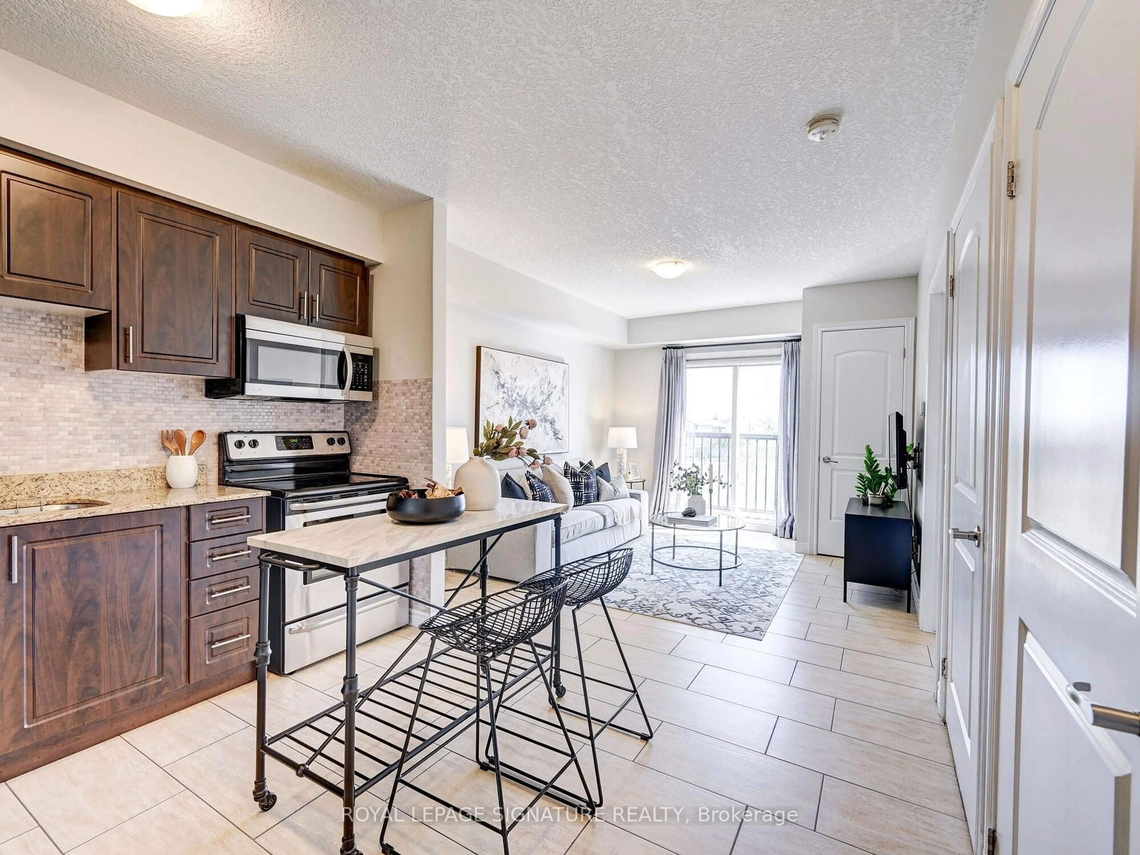 Open concept kitchen, ceramic/tile floor for 886 Golf Links Rd #205, Hamilton Ontario L9K 1J8