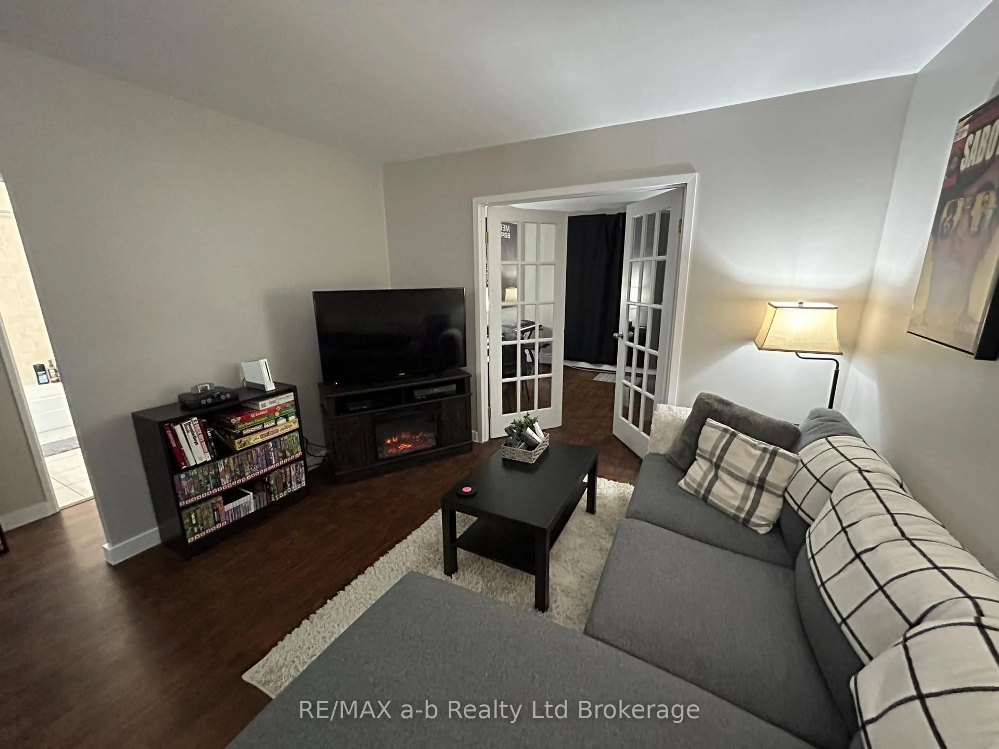 Living room with furniture, wood/laminate floor for 583 Mornington Ave #501, London East Ontario N5Y 3E9