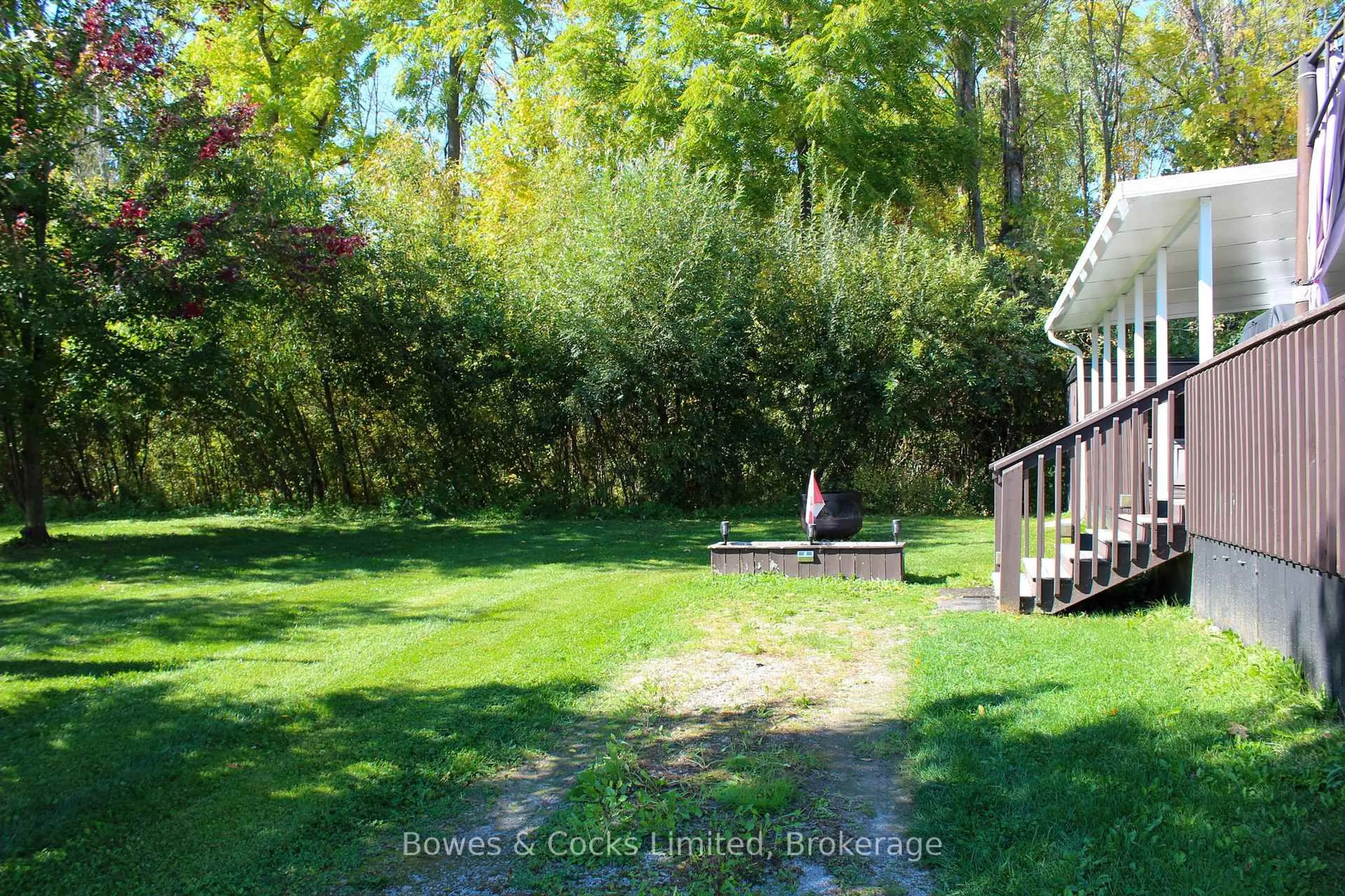 A pic from outside/outdoor area/front of a property/back of a property/a pic from drone, forest/trees view for 1235 Villiers Line #LAWSON Cres. 14, Otonabee-South Monaghan Ontario K0L 2G0