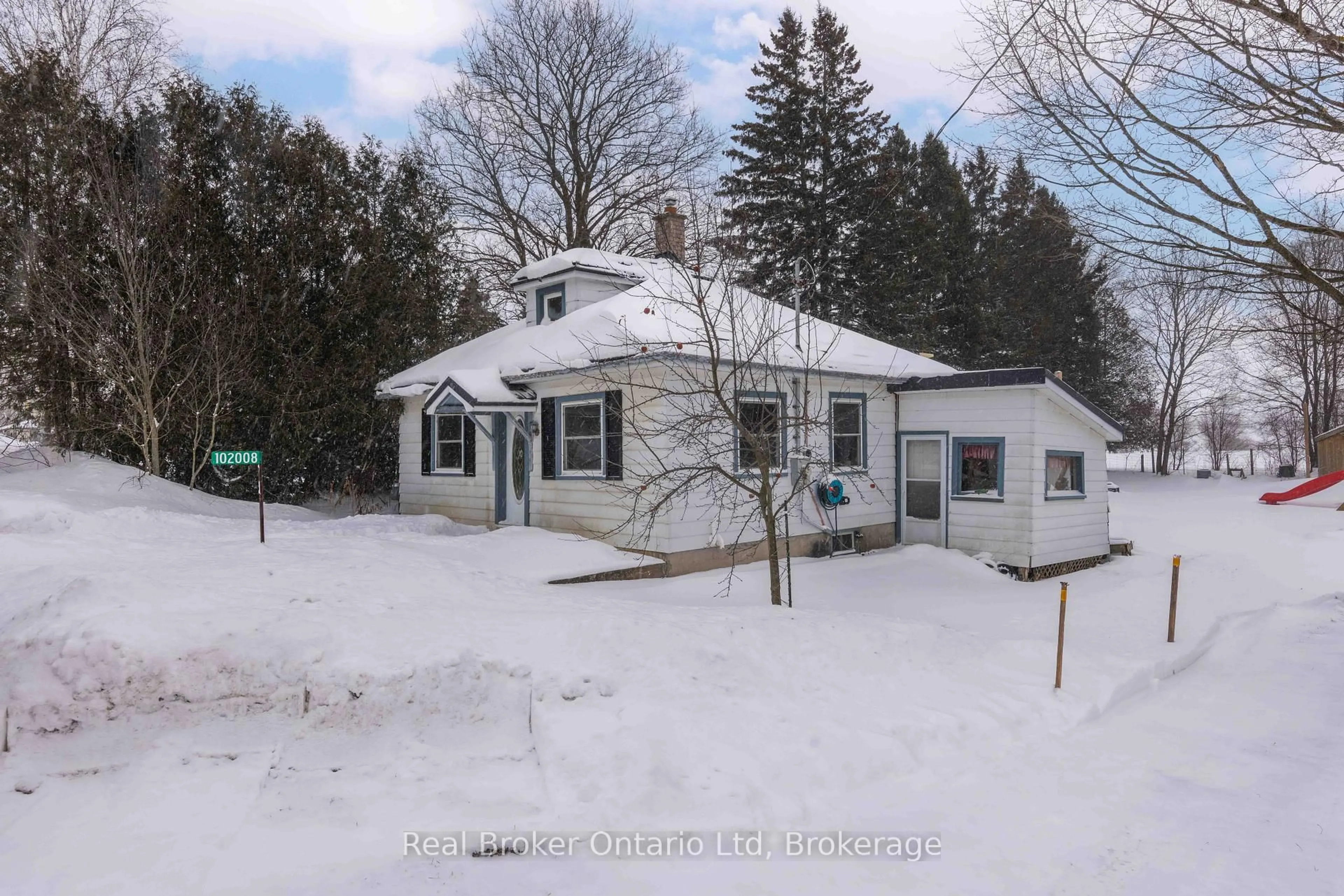 A pic from outside/outdoor area/front of a property/back of a property/a pic from drone, street for 102008 Grey Road 5 Rd, Georgian Bluffs Ontario N4K 5N5
