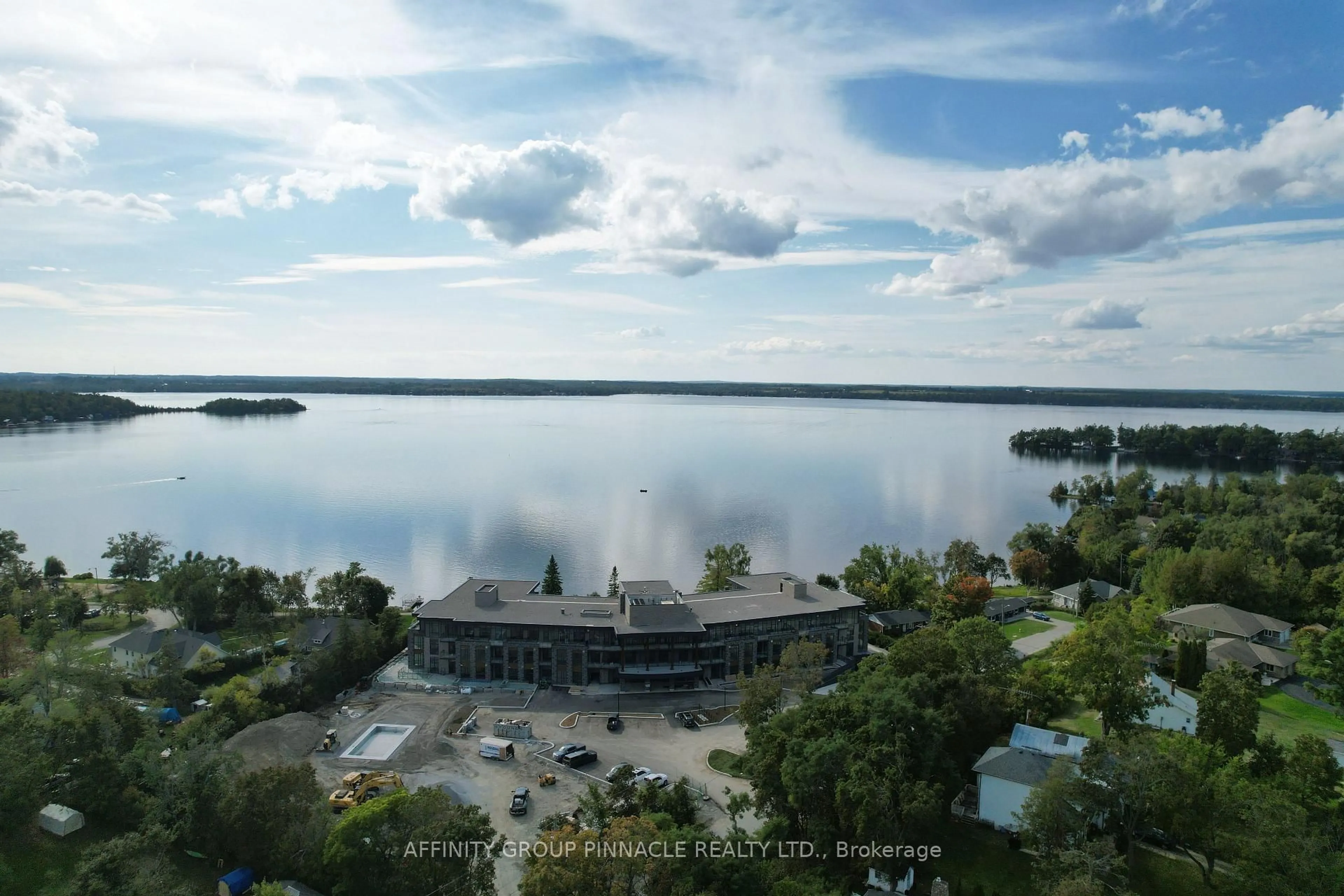 A pic from outside/outdoor area/front of a property/back of a property/a pic from drone, water/lake/river/ocean view for 99 Louisa St #201, Kawartha Lakes Ontario K0M 1N0
