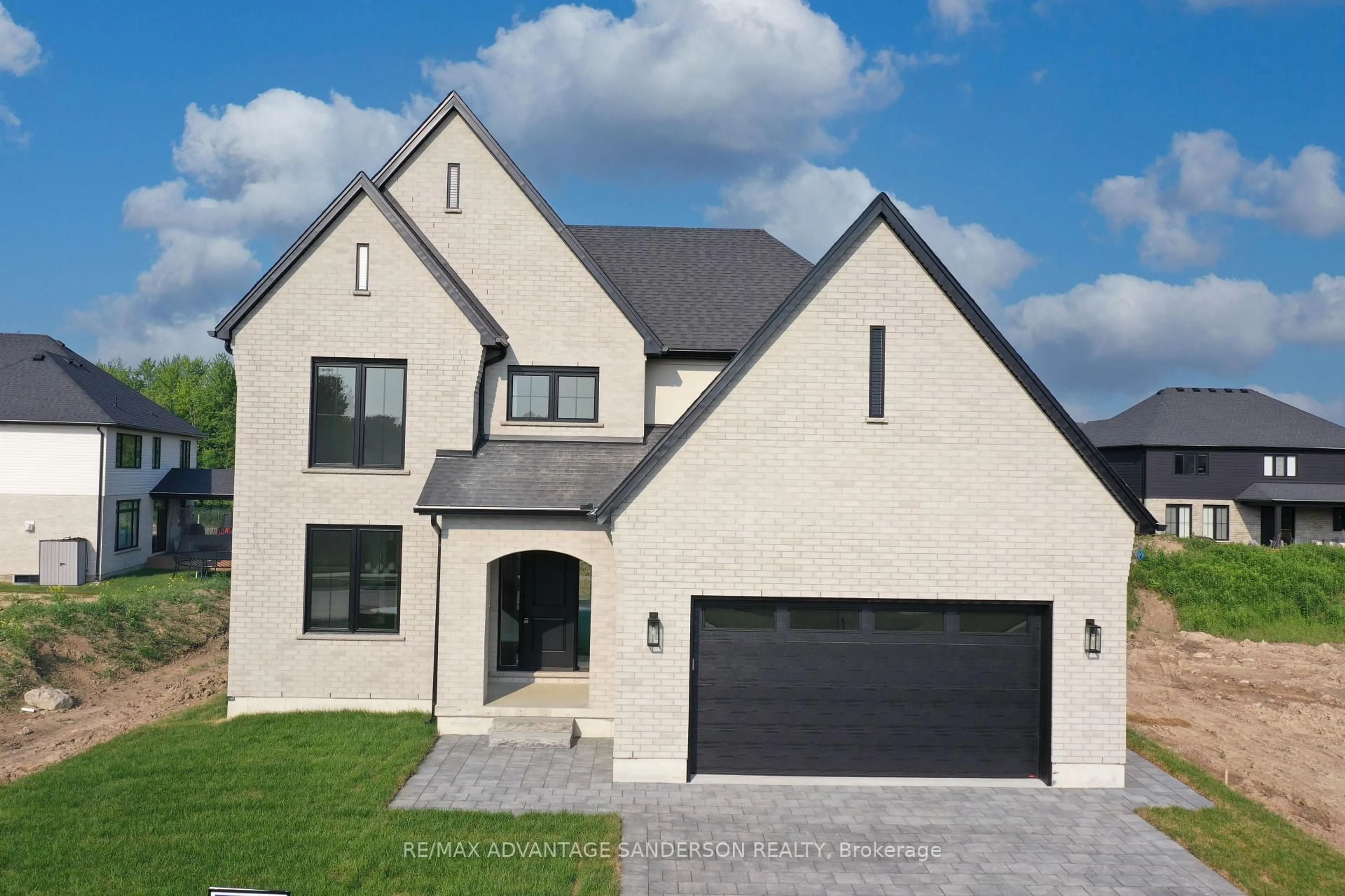 Home with brick exterior material, street for 174 Timberwalk Tr, Middlesex Centre Ontario N0M 2A0