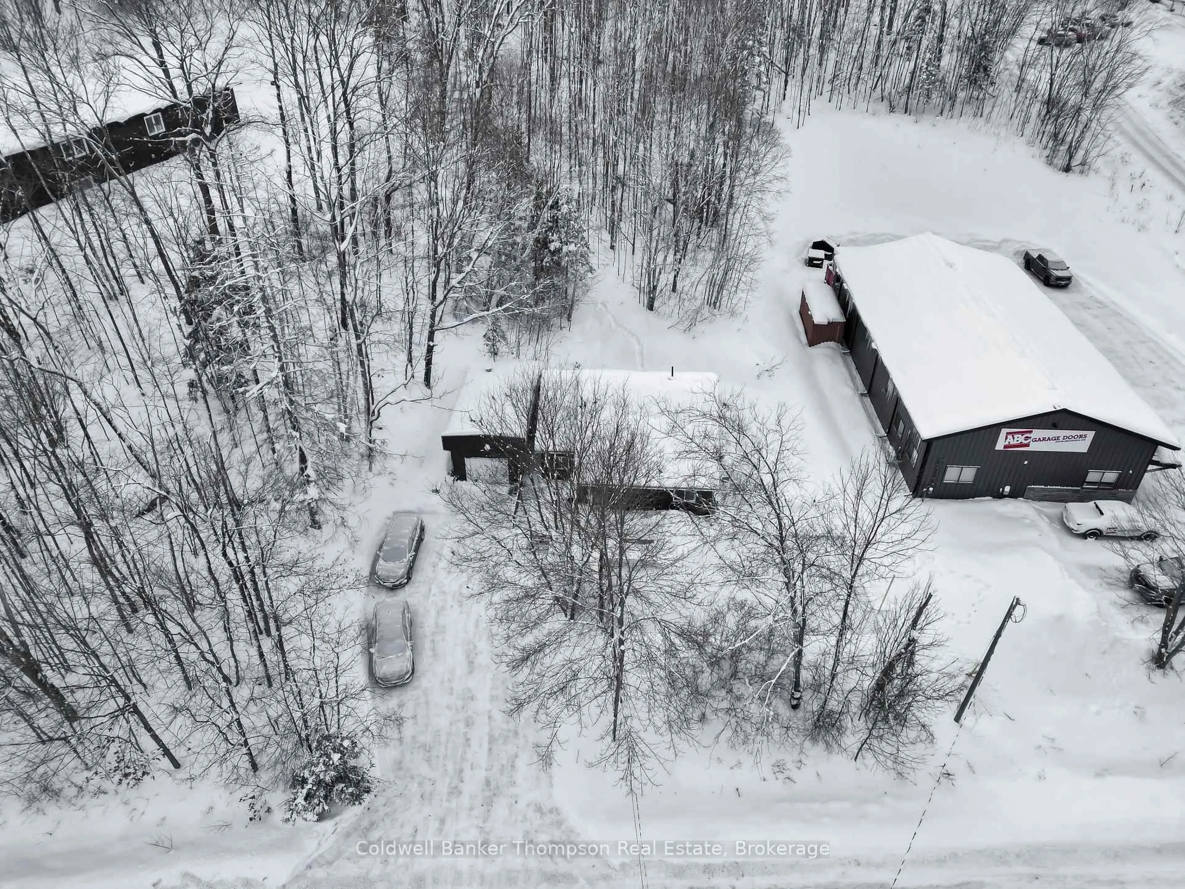 A pic from outside/outdoor area/front of a property/back of a property/a pic from drone, street for 103 Lindgren Rd, Huntsville Ontario P1H 1Y2