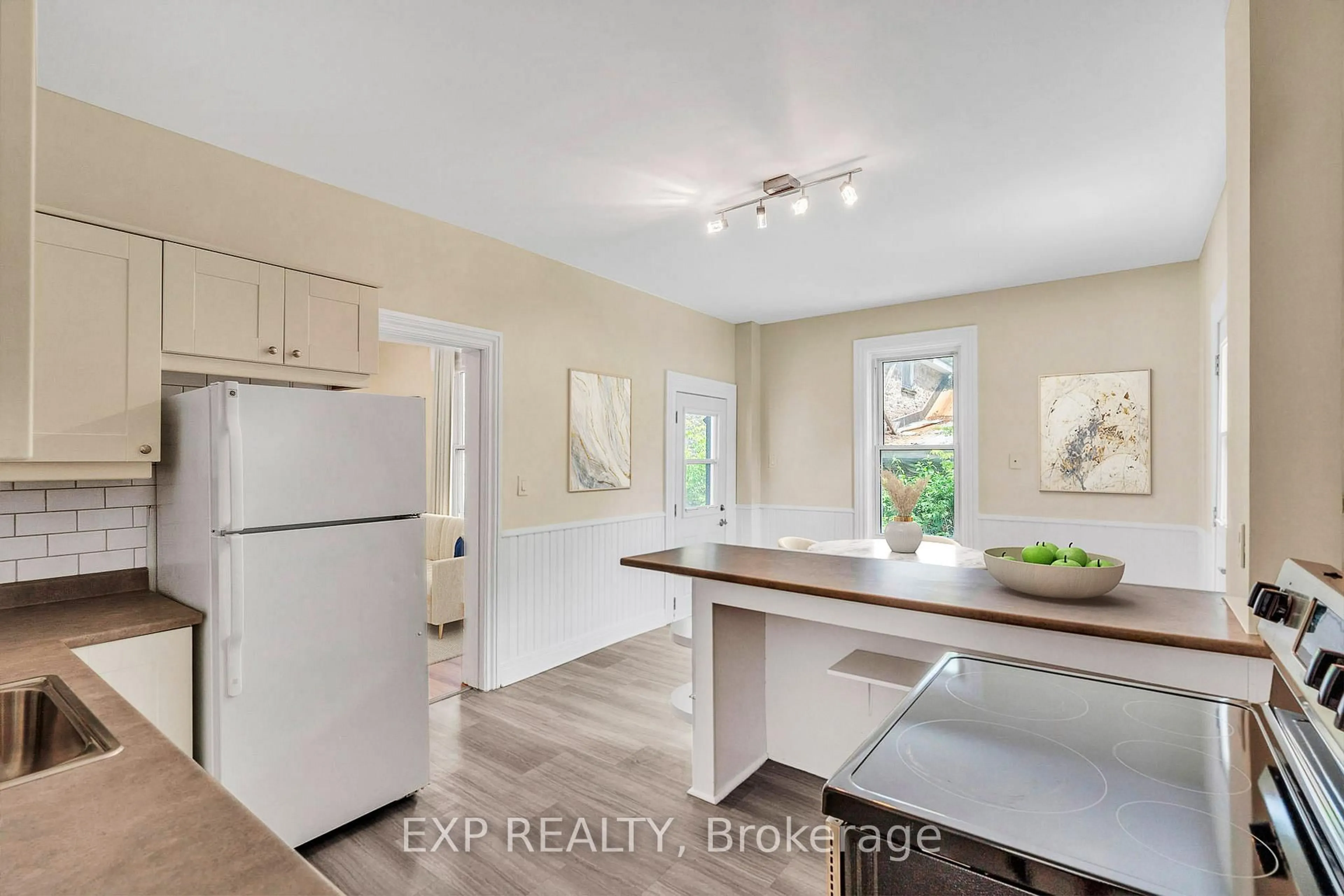 Open concept kitchen, wood/laminate floor for 14-16 CLOTHIER St, North Grenville Ontario K0G 1J0