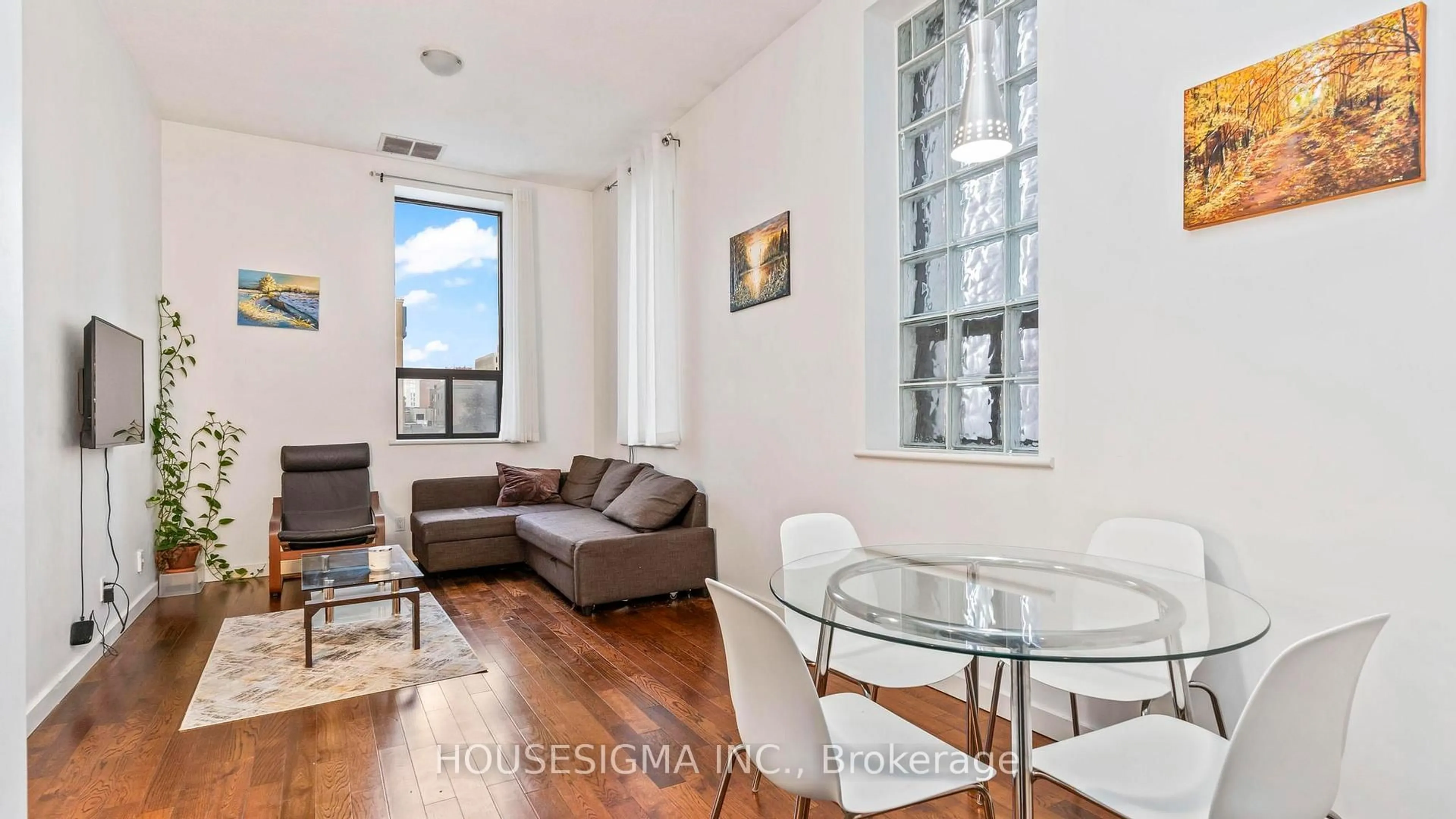 Living room with furniture, wood/laminate floor for 272 Dundas St #204, London East Ontario N6B 1T6