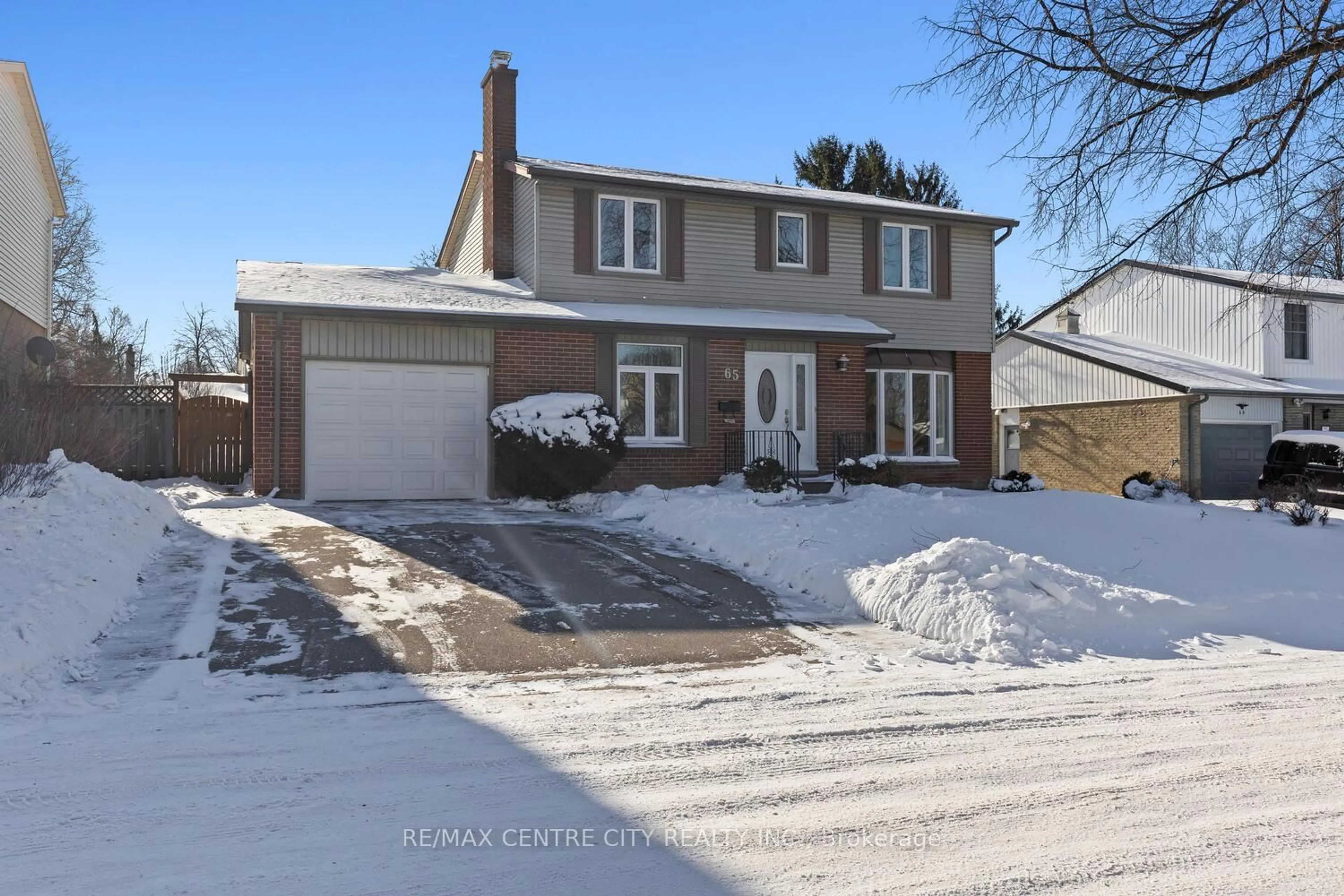 Home with brick exterior material, street for 65 Paddock Green Cres, London South Ontario N6J 3P6
