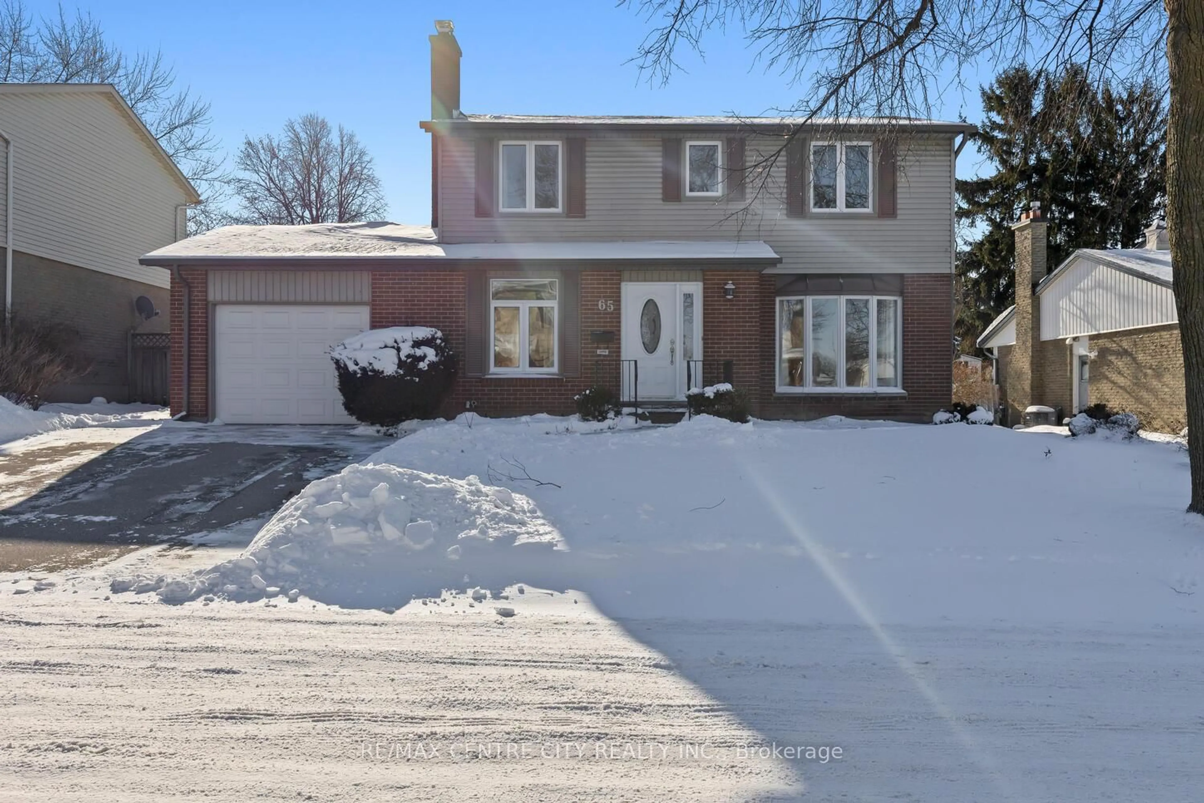 Home with brick exterior material, street for 65 Paddock Green Cres, London South Ontario N6J 3P6