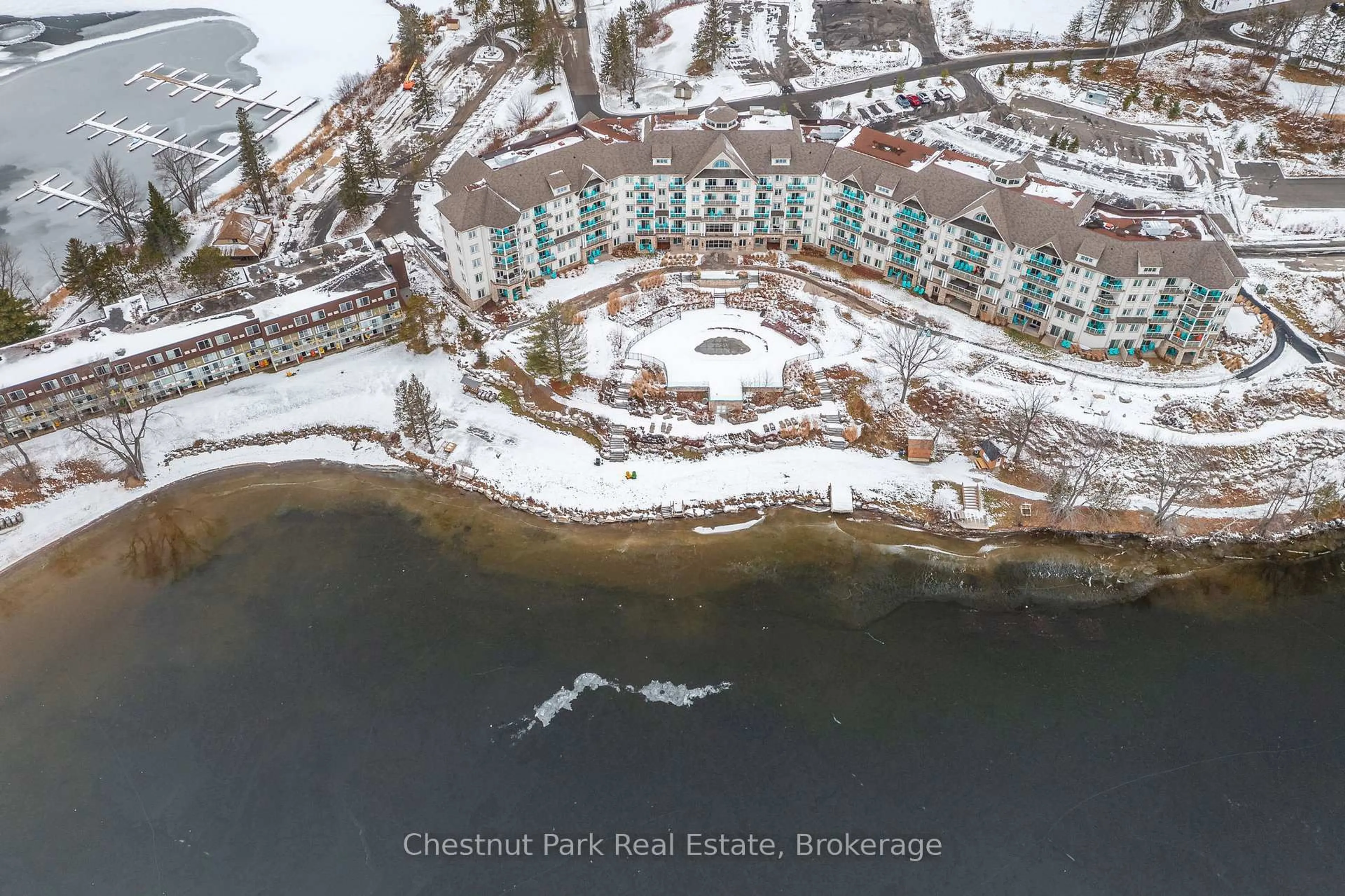 A pic from outside/outdoor area/front of a property/back of a property/a pic from drone, water/lake/river/ocean view for 25 Pen Lake Point Rd #206, Huntsville Ontario P1H 1A9