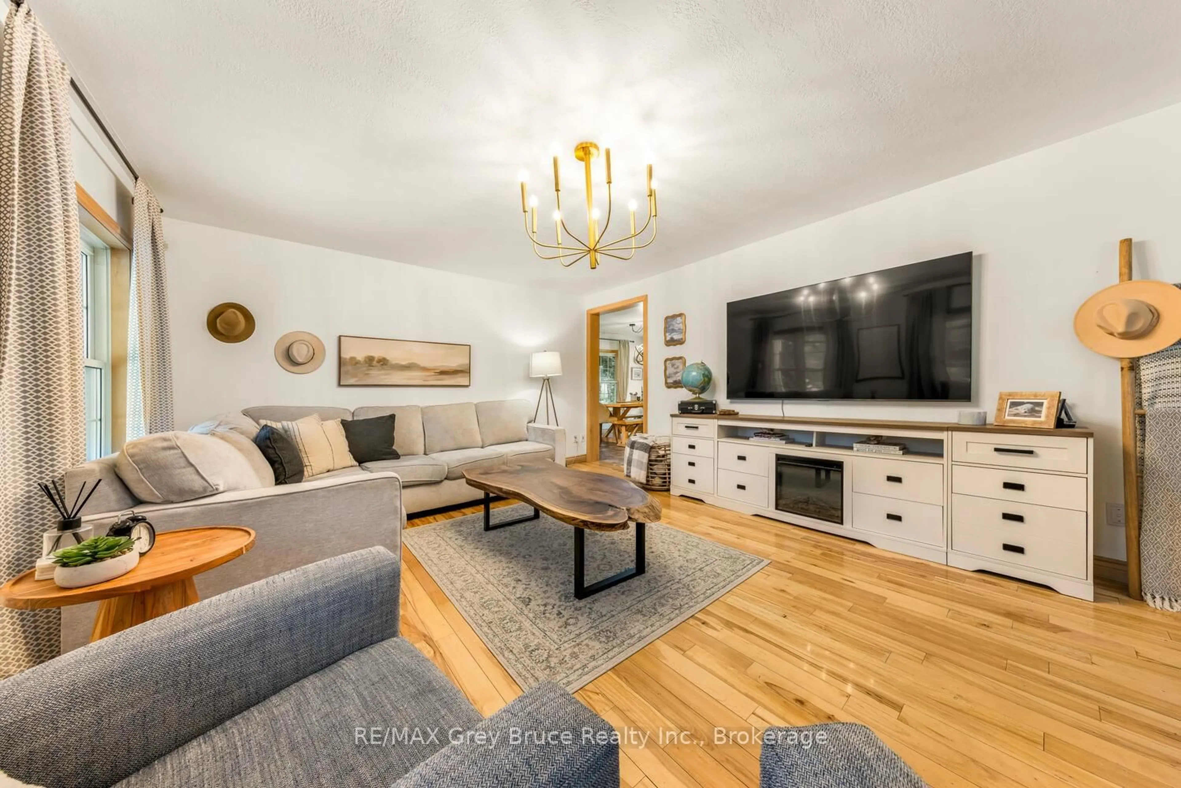 Living room with furniture, wood/laminate floor for 32 Sandy Pines Tr, South Bruce Peninsula Ontario N0H 2G0