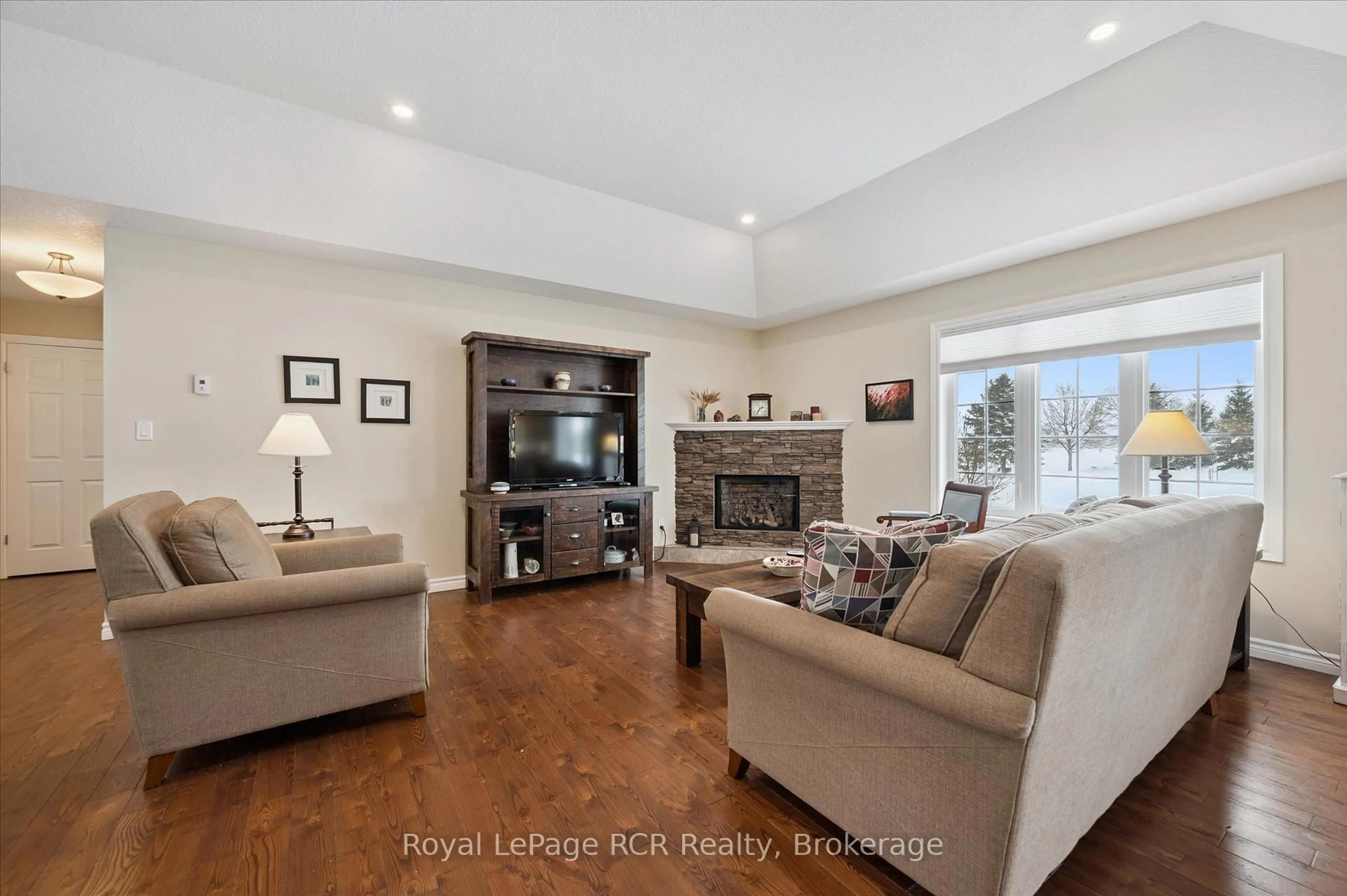 Living room with furniture, wood/laminate floor for 10 Sparberry St, Southgate Ontario N0G 2L0