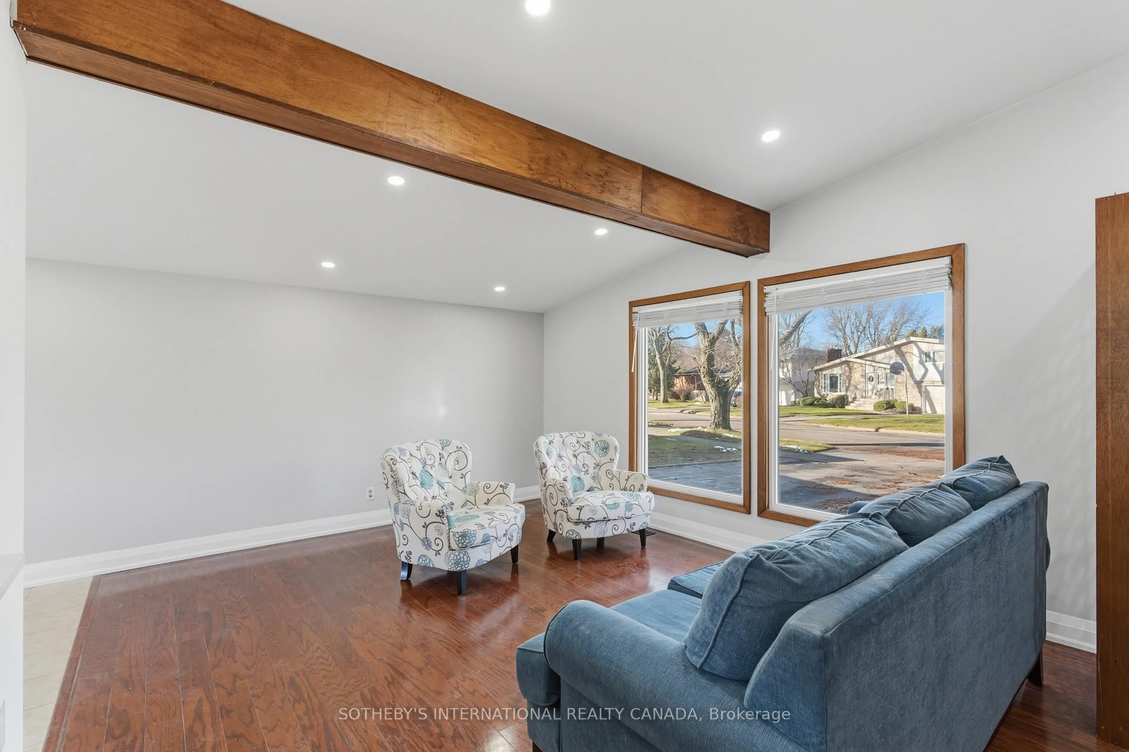 Living room with furniture, wood/laminate floor for 4206 Glenayr Ave, Niagara Falls Ontario L2E 6J9