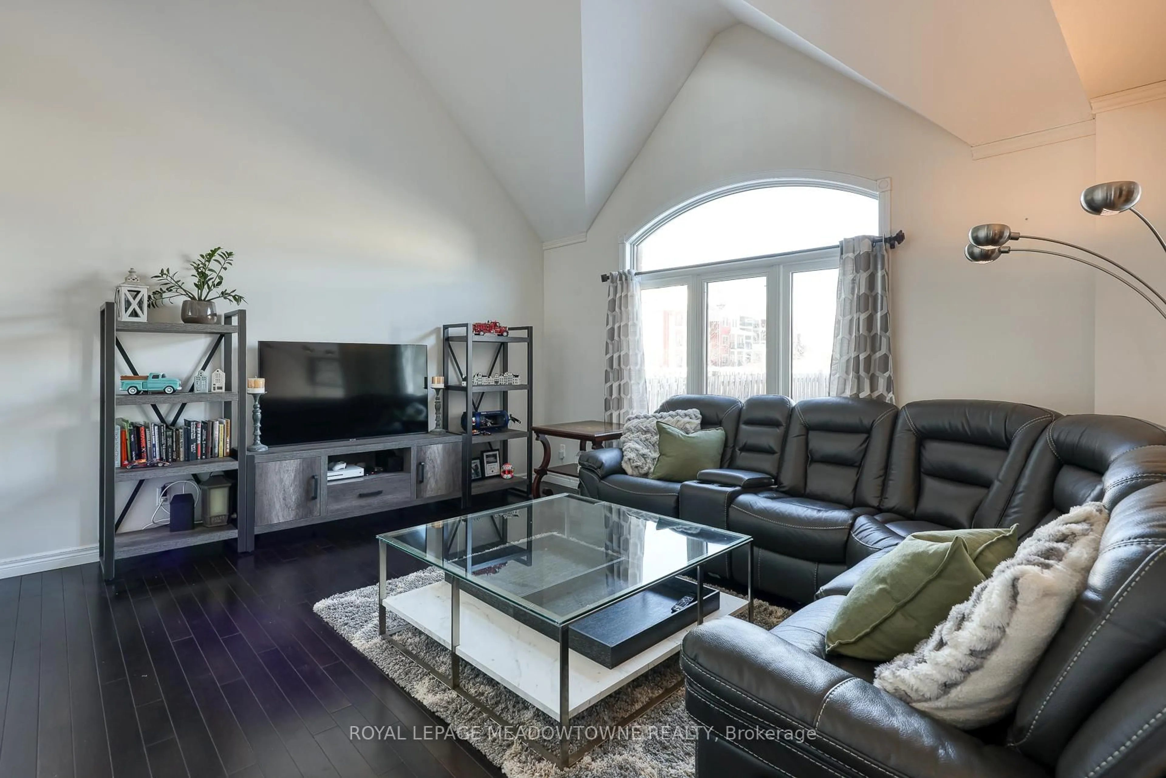 Living room with furniture, wood/laminate floor for 739 Frontenac Cres, Woodstock Ontario N4V 0B1