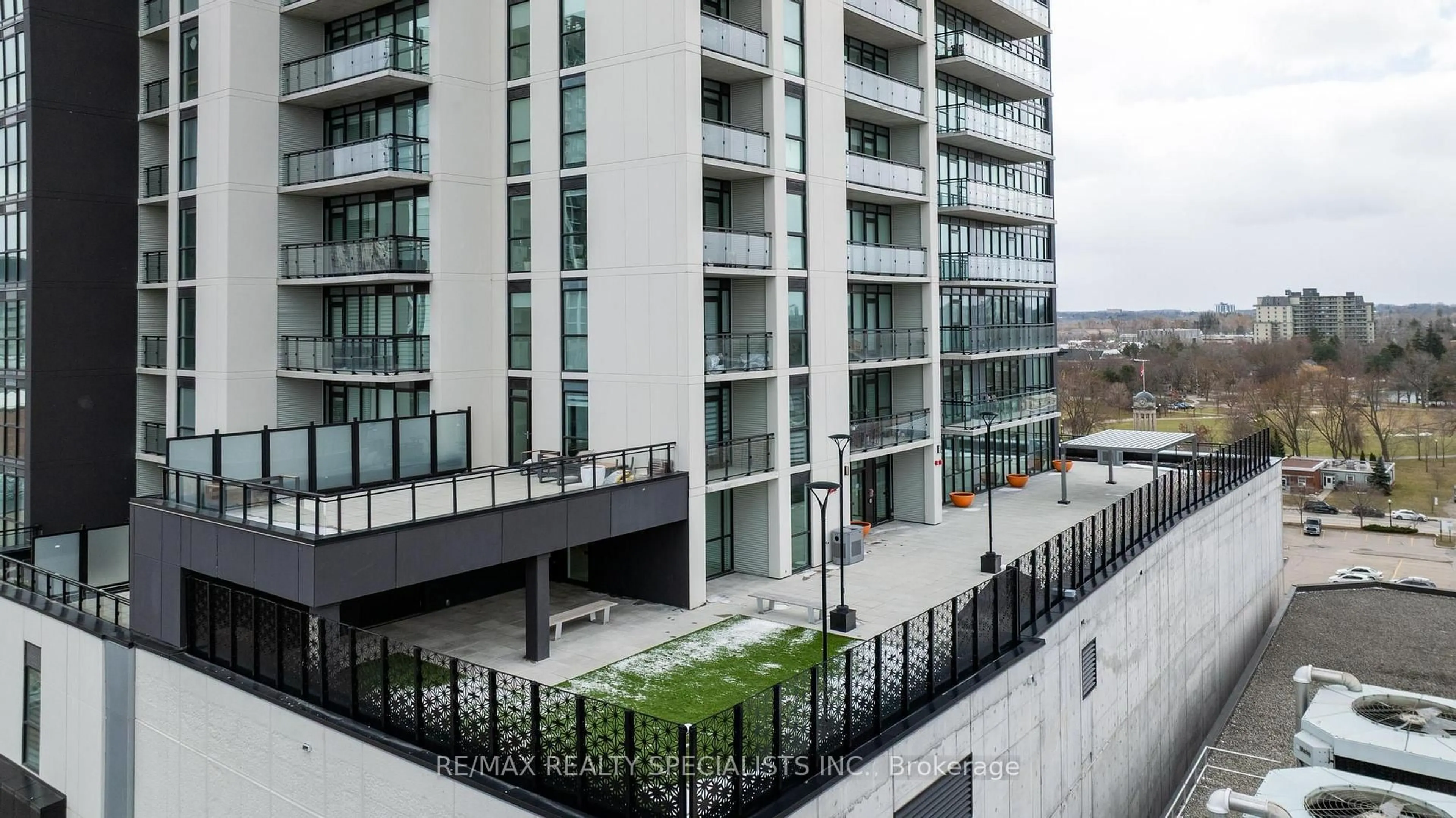 Patio, city buildings view from balcony for 60 Charles St W St #308, Kitchener Ontario N2G 0C9