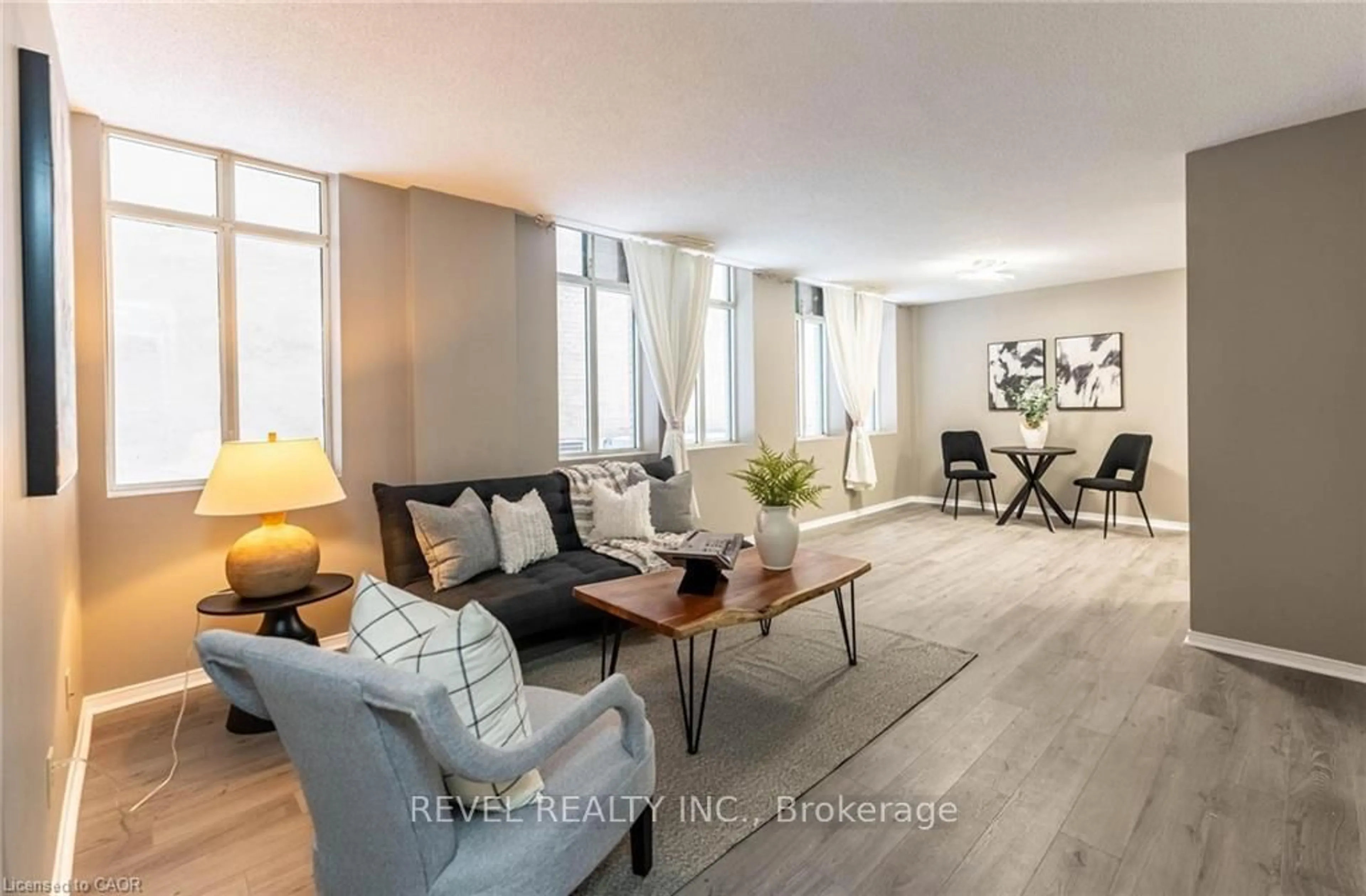 Living room with furniture, unknown for 36 James St #303, Hamilton Ontario L8P 4W4