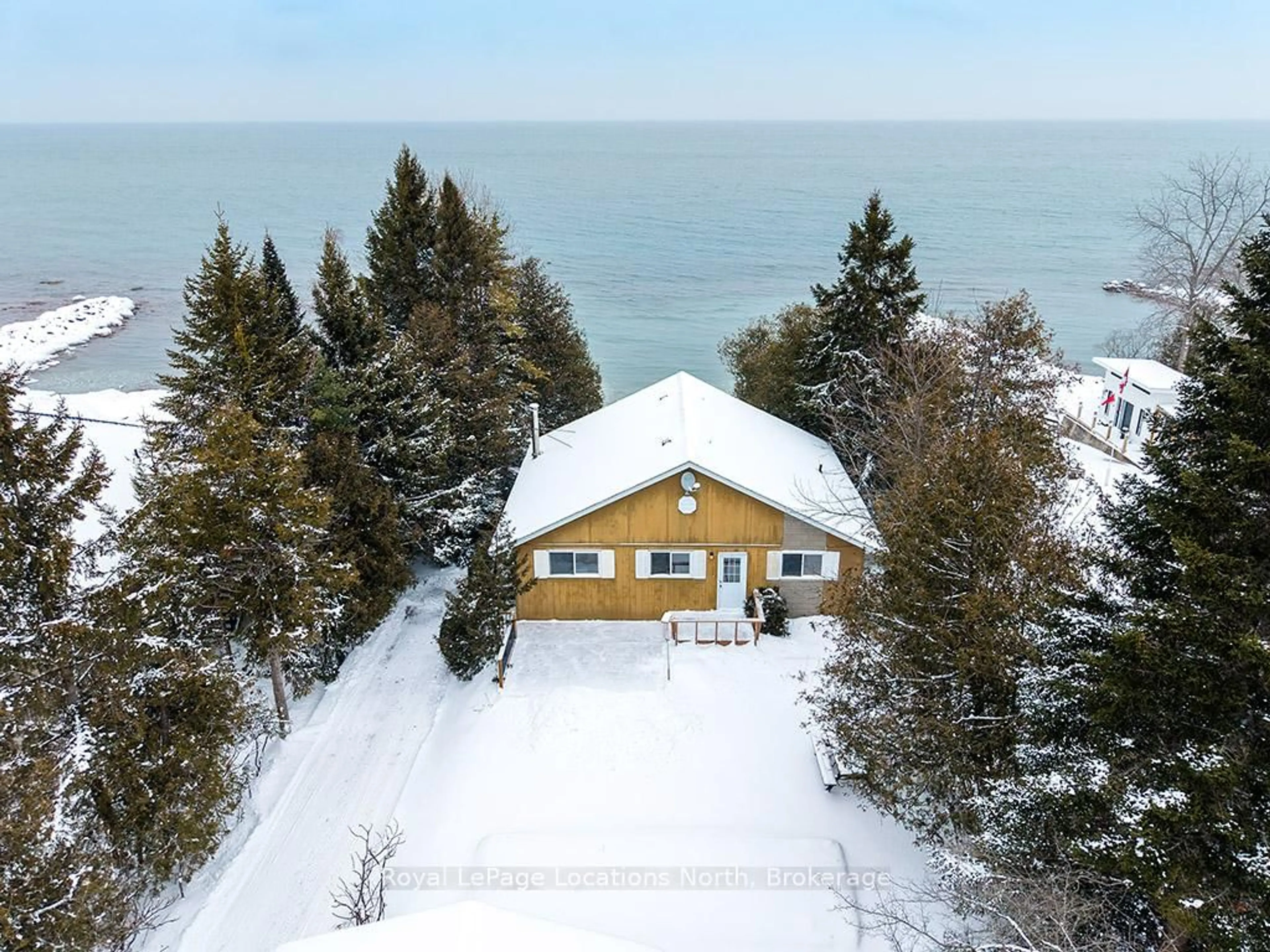 A pic from outside/outdoor area/front of a property/back of a property/a pic from drone, water/lake/river/ocean view for 227 Sunset Blvd, Blue Mountains Ontario N0H 2P0