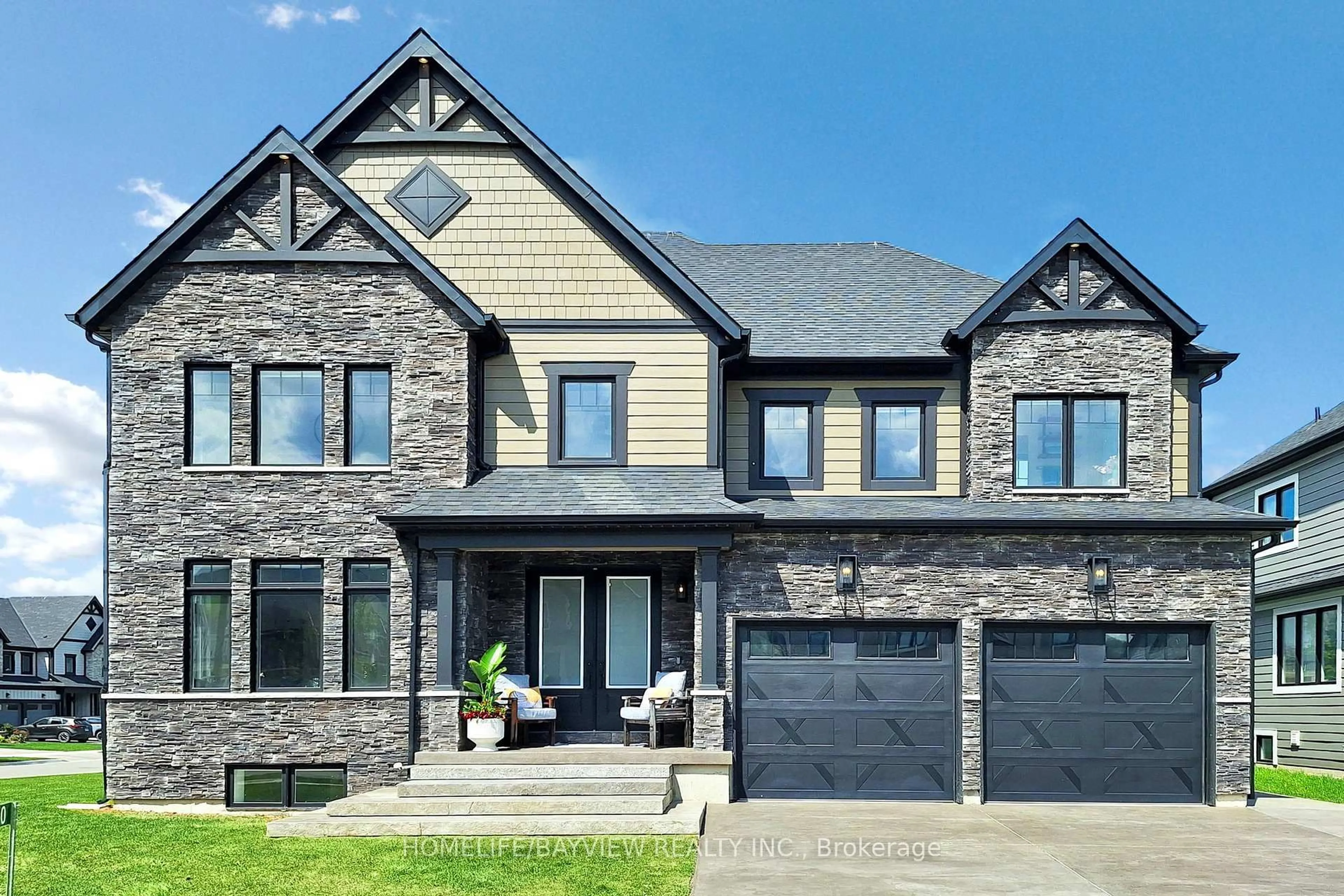 Home with brick exterior material, street for 100 Reed Way, Blue Mountains Ontario L9Y 4P5