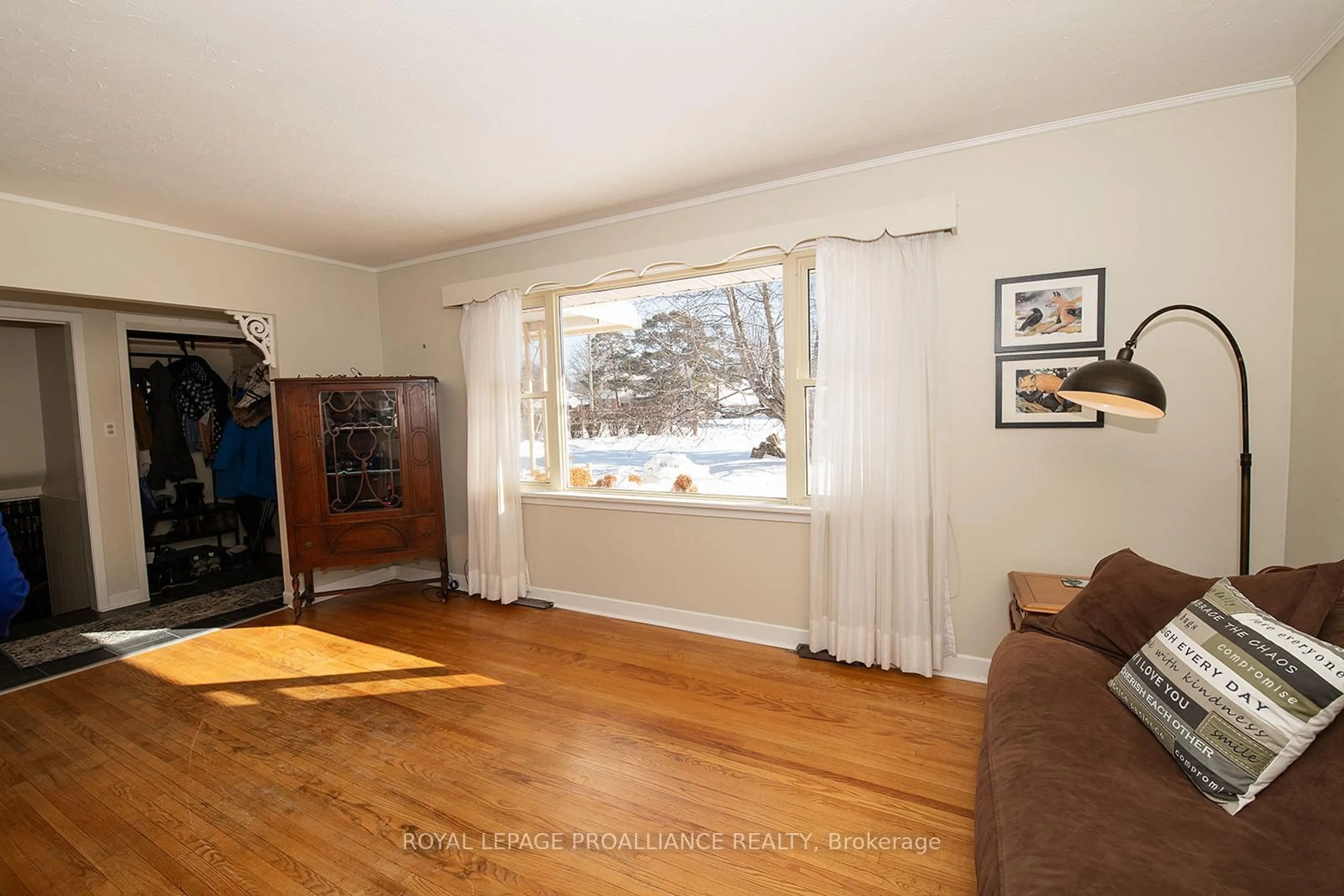 Living room with furniture, wood/laminate floor for 26 Plaza Sq, Belleville Ontario K8N 4J3