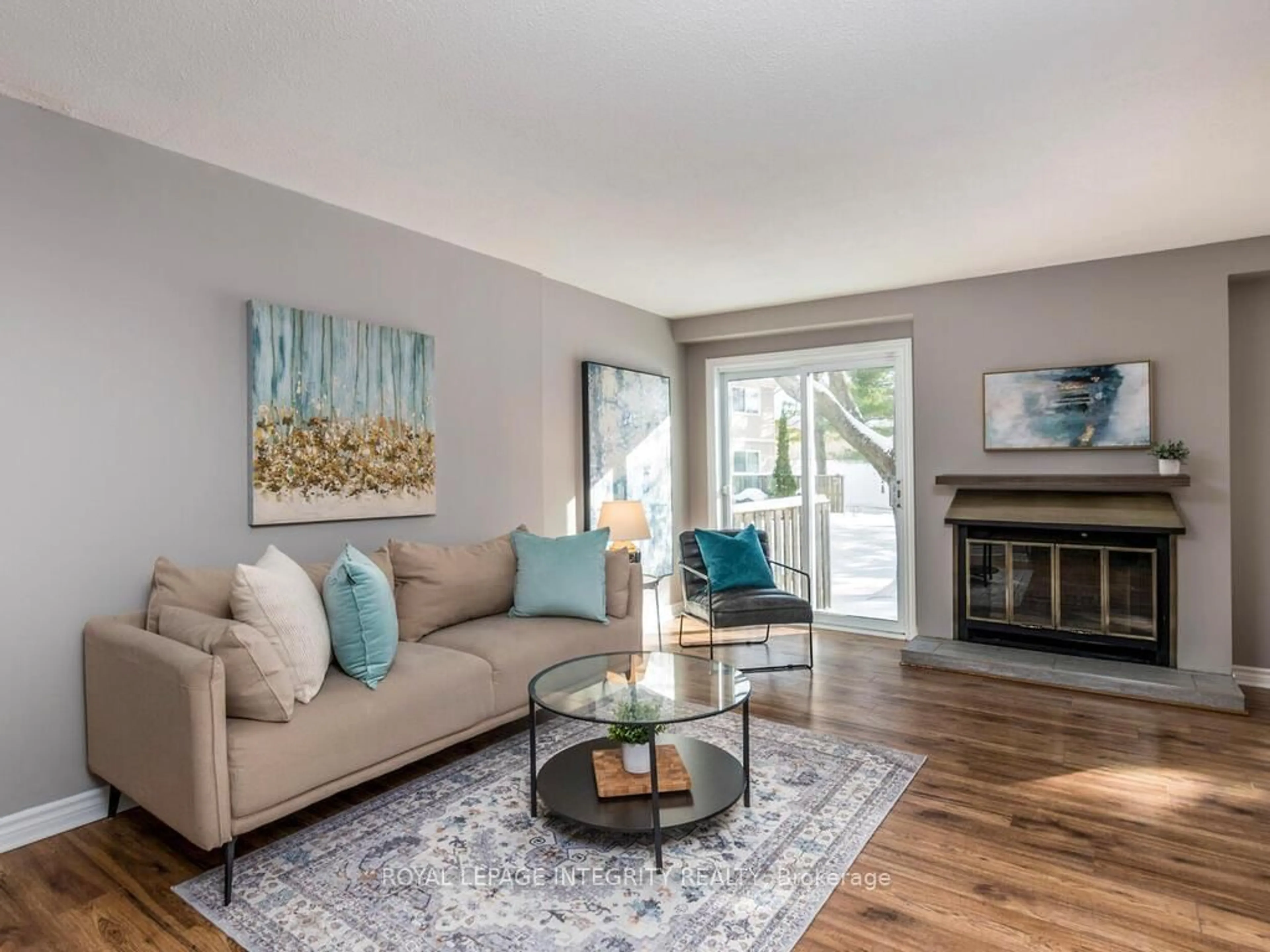 Living room with furniture, wood/laminate floor for 146 Valley Stream Dr #14, Ottawa Ontario K2H 9C6