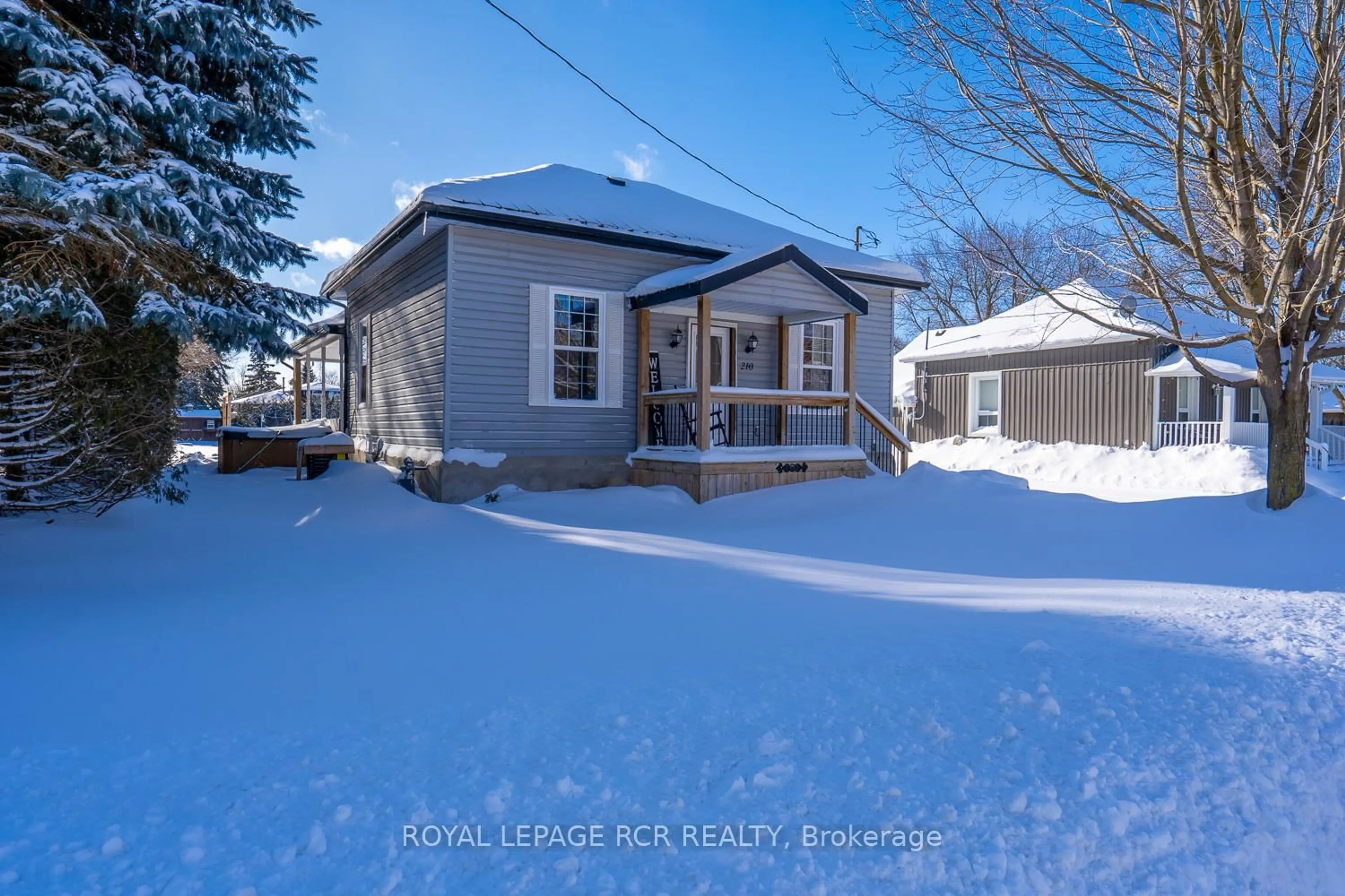 A pic from outside/outdoor area/front of a property/back of a property/a pic from drone, street for 210 Carrol St, Wellington North Ontario N0G 1A0