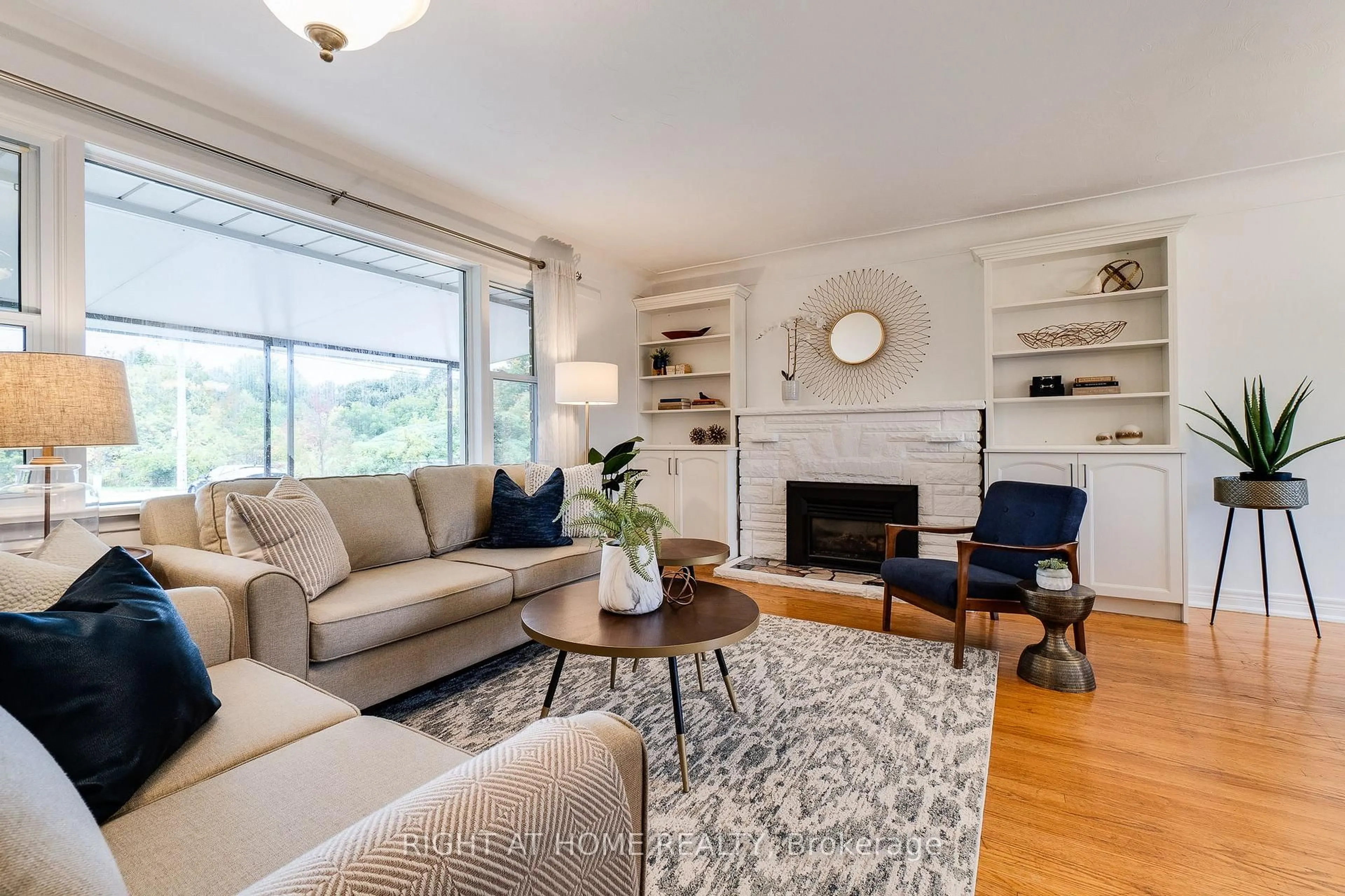 Living room with furniture, wood/laminate floor for 435 Parkside Dr, Hamilton Ontario L8B 0Y6