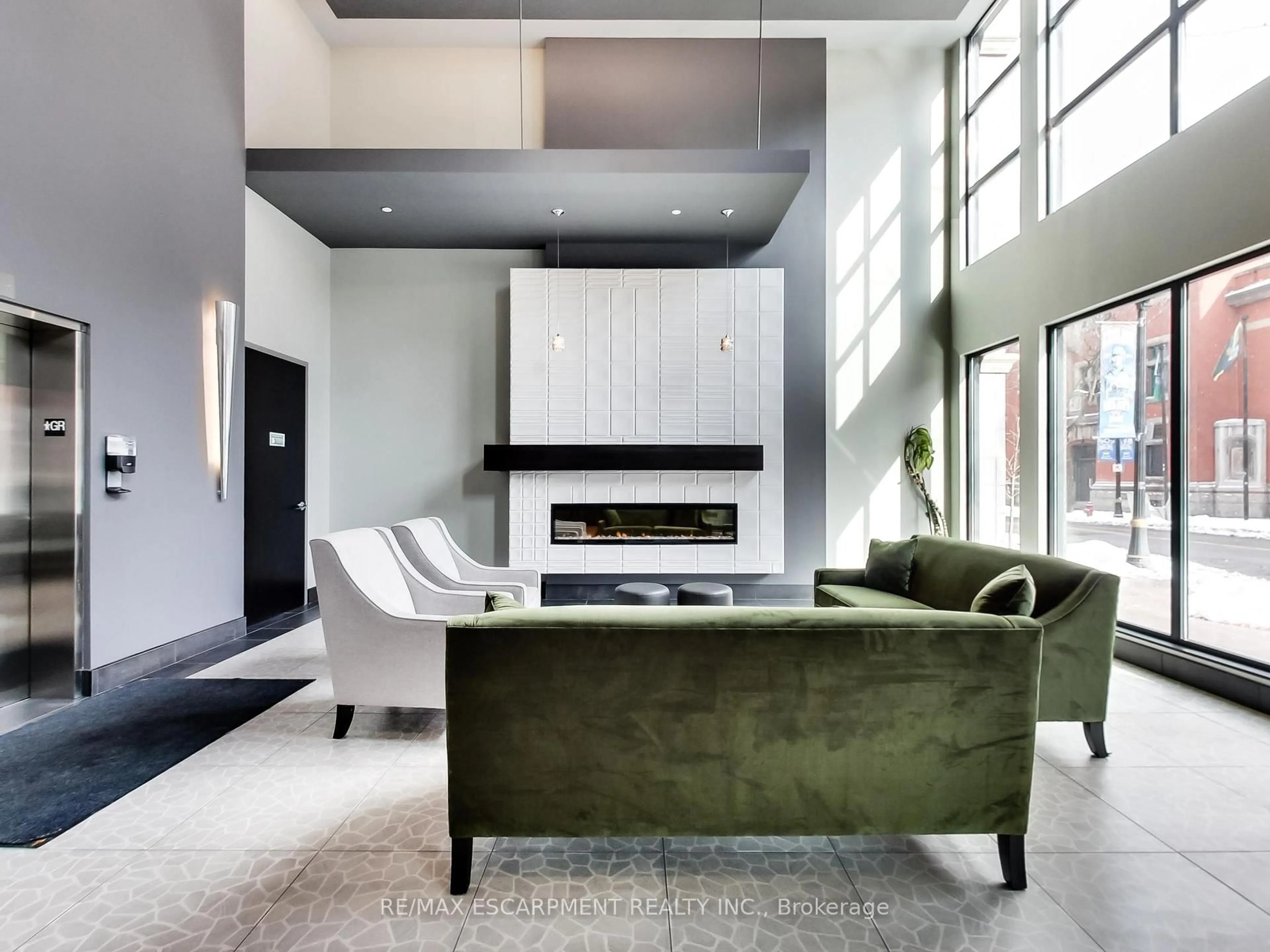 Living room with furniture, cement floor for 181 James St #306, Hamilton Ontario L8R 2K9