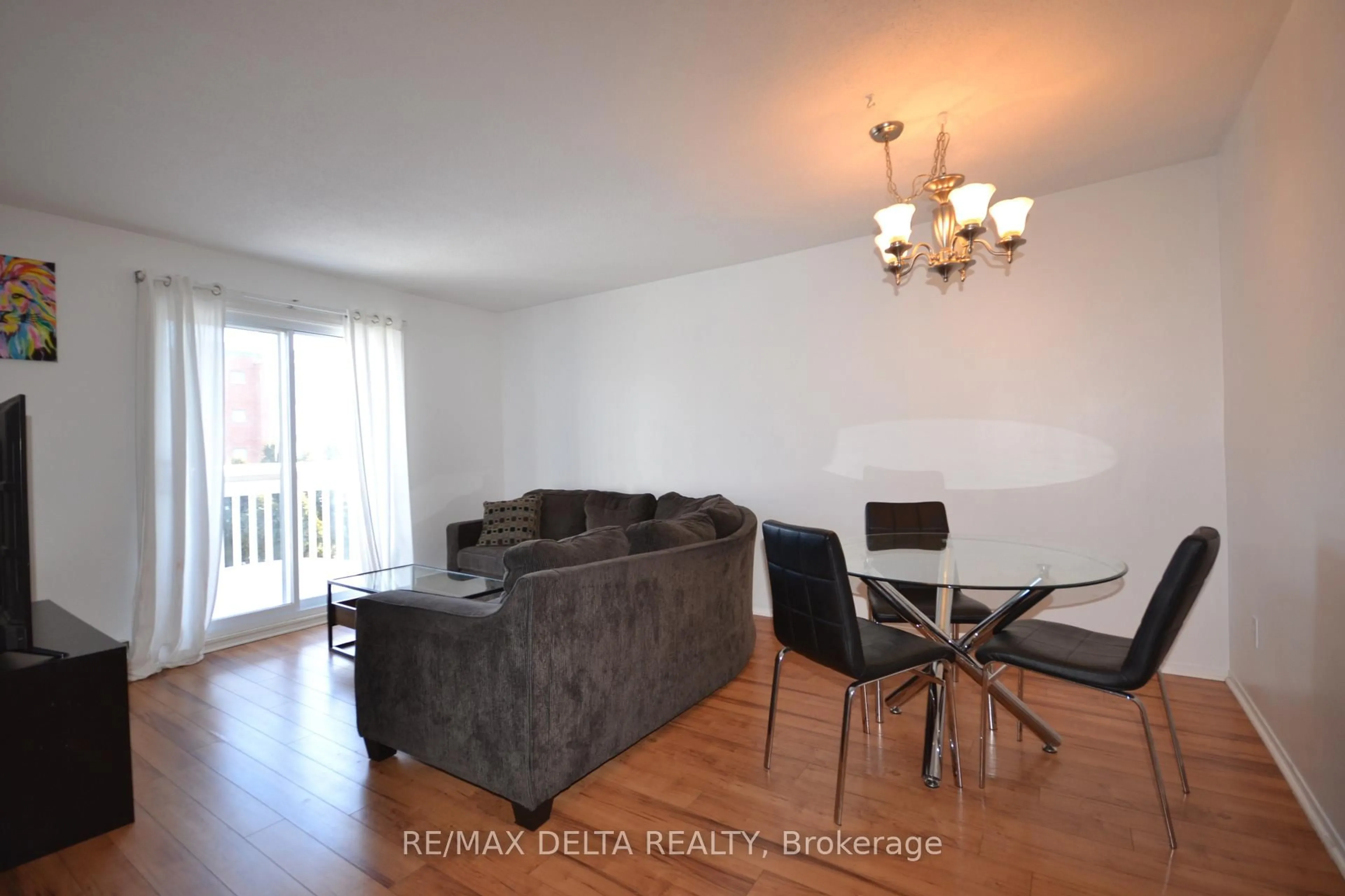 Living room with furniture, wood/laminate floor for 325 Centrum Blvd #412, Ottawa Ontario K1E 3W8