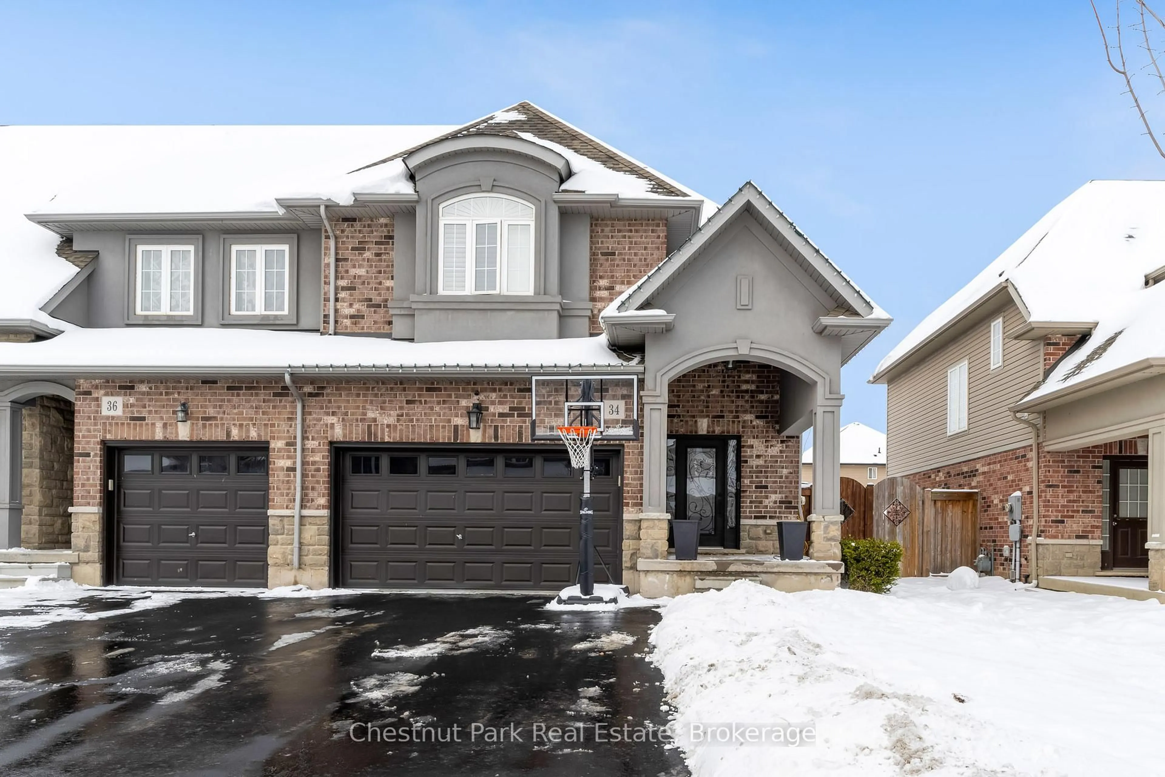 Home with brick exterior material, street for 34 Medici Lane, Hamilton Ontario L9B 0C8