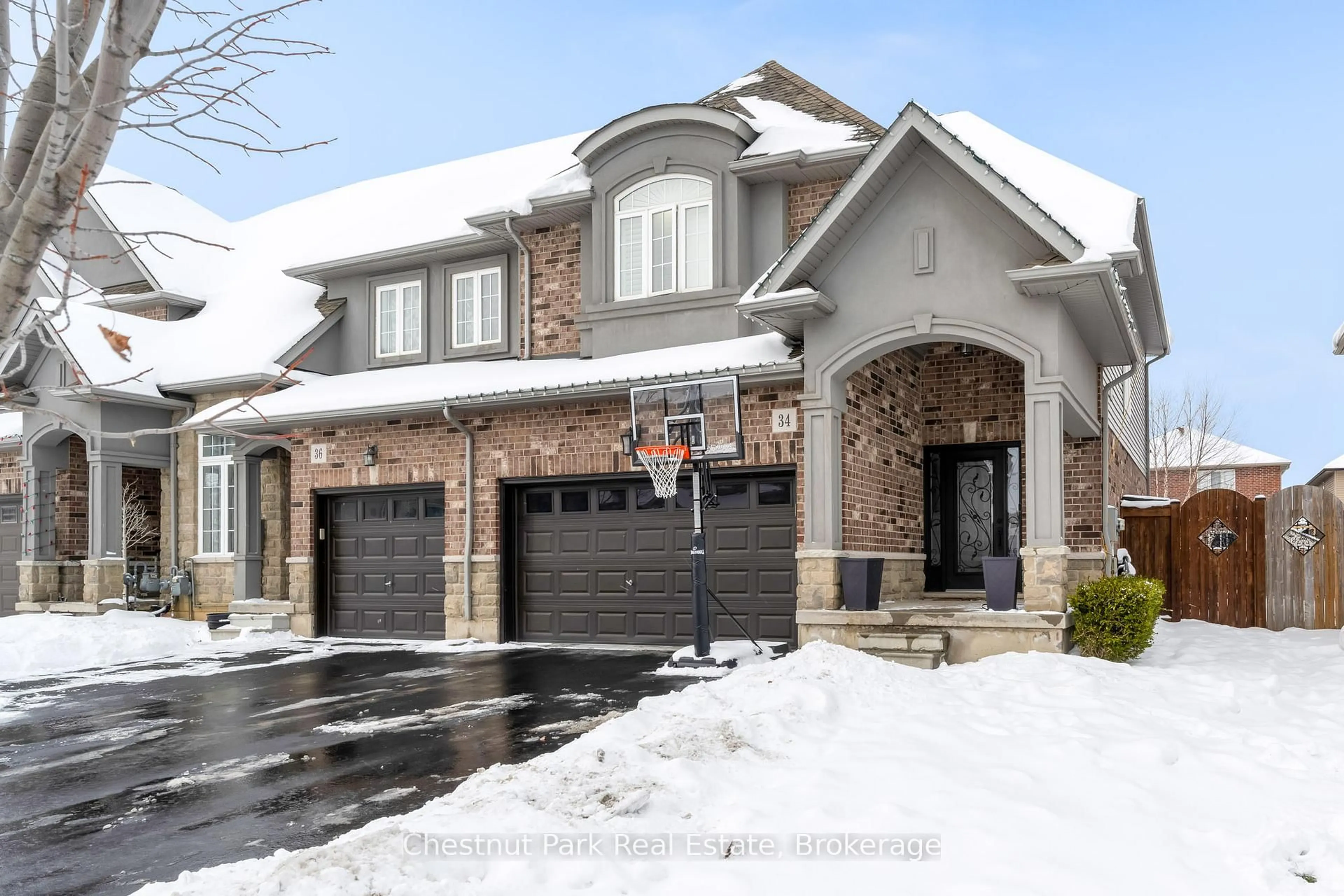 Home with brick exterior material, street for 34 Medici Lane, Hamilton Ontario L9B 0C8