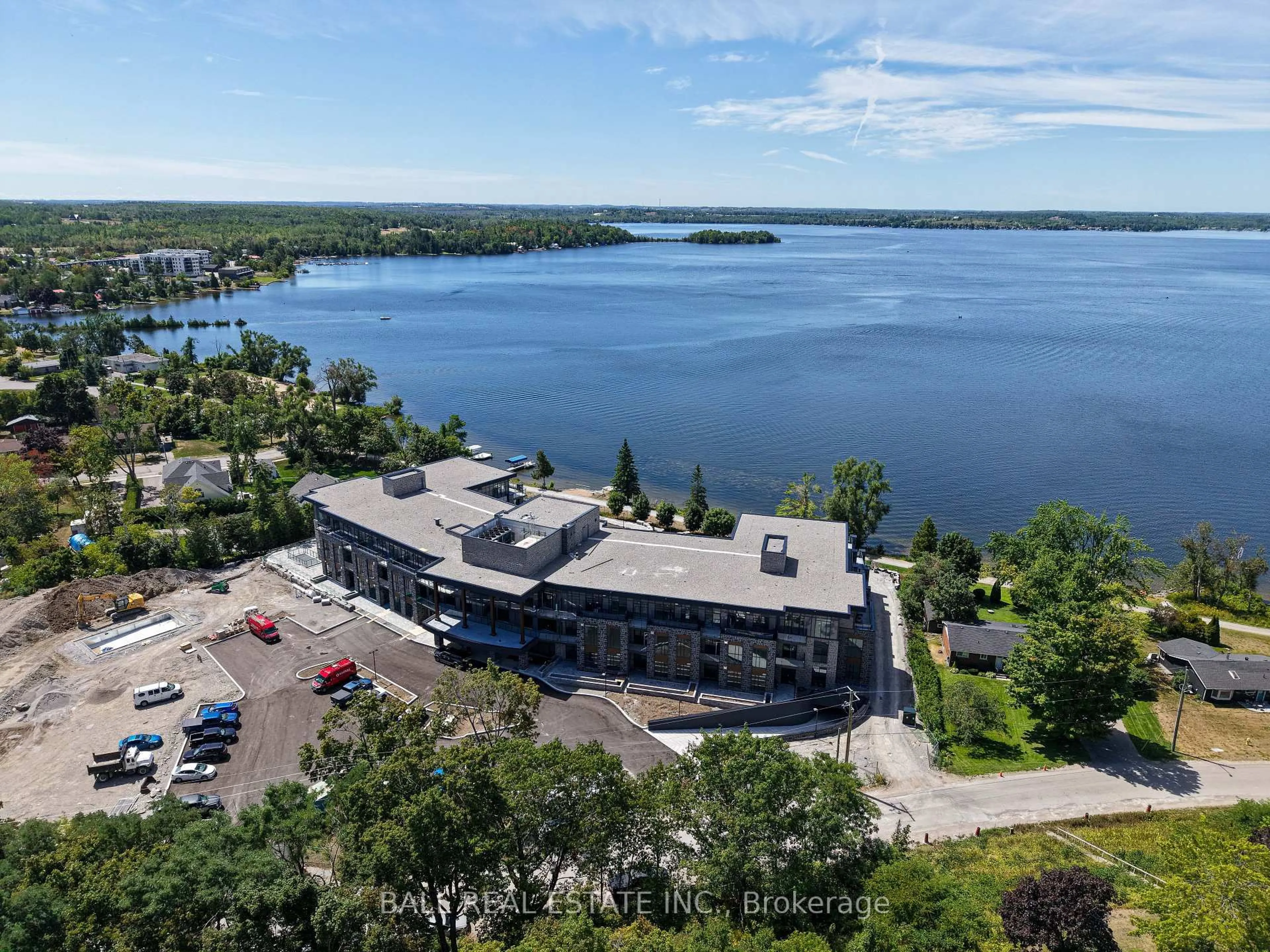 A pic from outside/outdoor area/front of a property/back of a property/a pic from drone, water/lake/river/ocean view for 99 Louisa St #214, Kawartha Lakes Ontario K0M 1N0