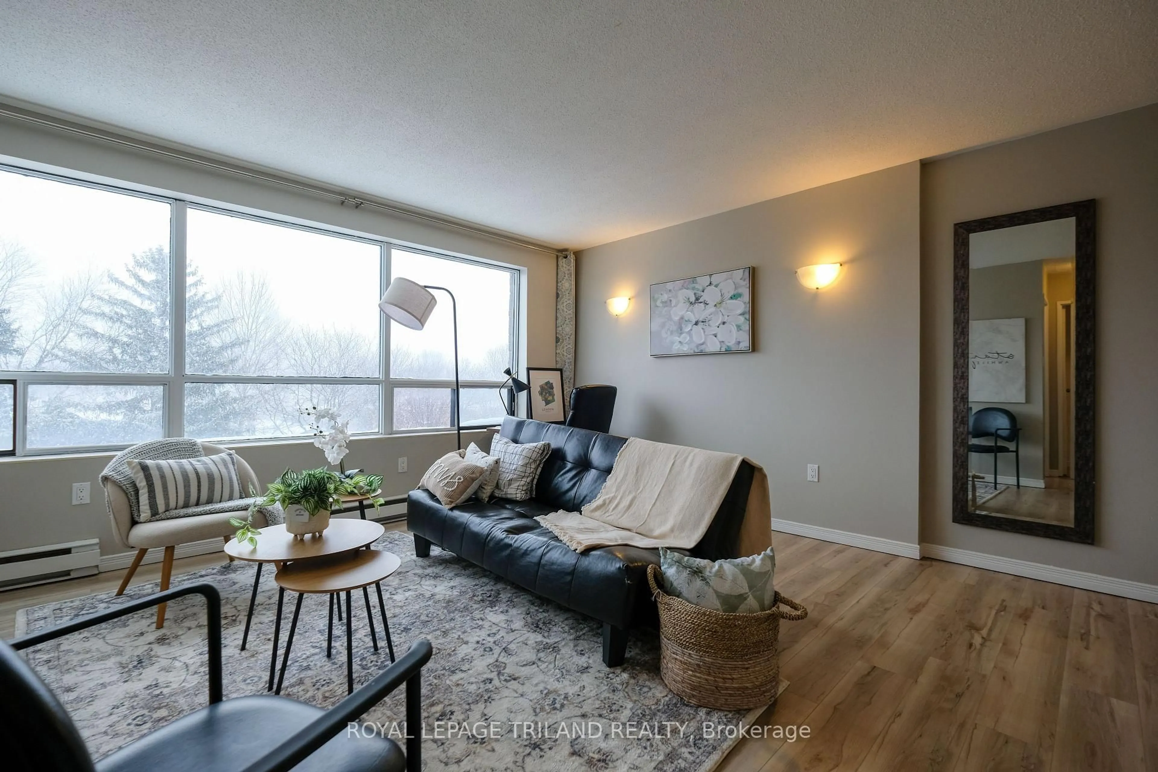 Living room with furniture, wood/laminate floor for 650 Cheapside St #605, London East Ontario N5Y 5J8