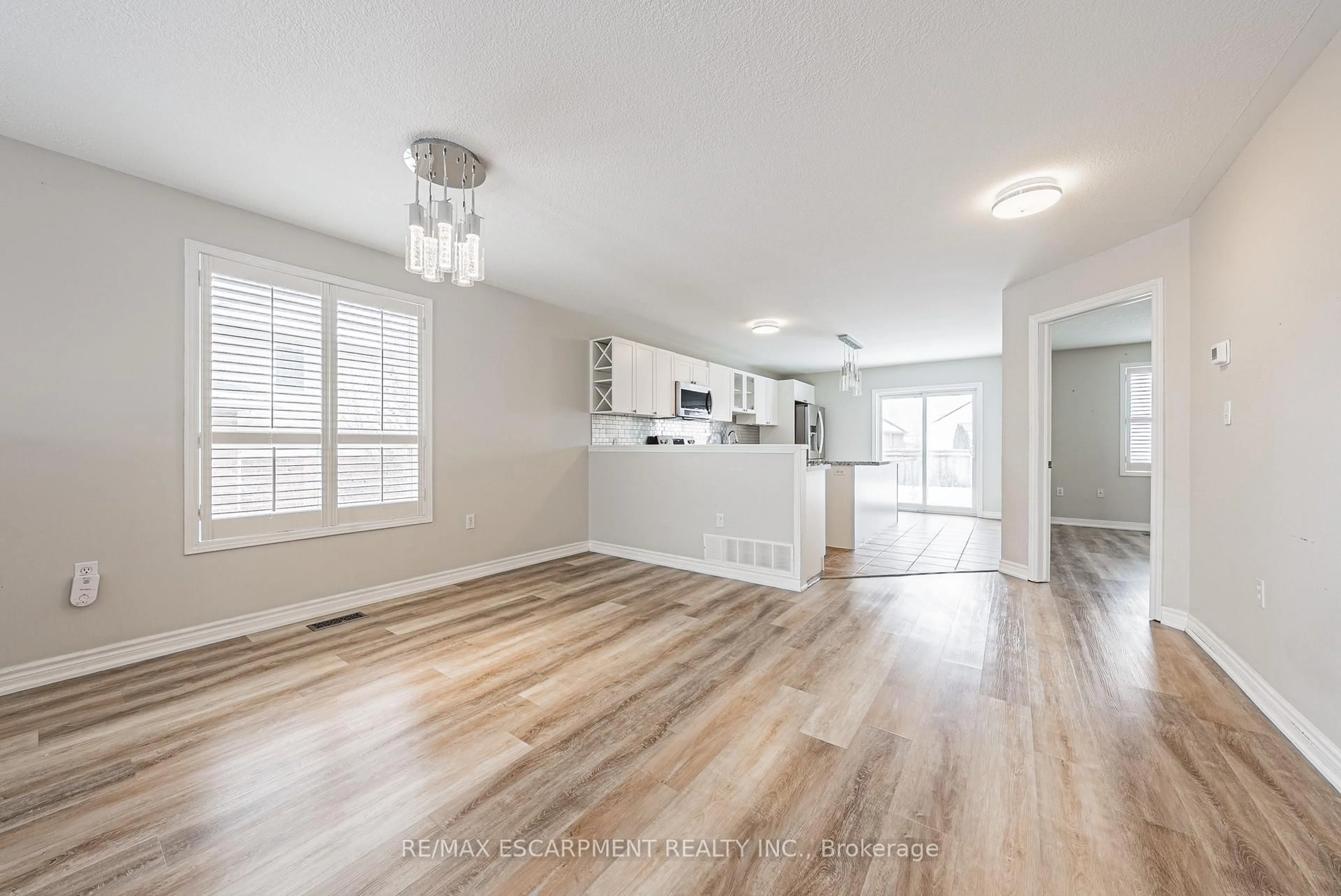 Open concept kitchen, wood/laminate floor for 12 Shadetree Cres, Hamilton Ontario L8J 3X2