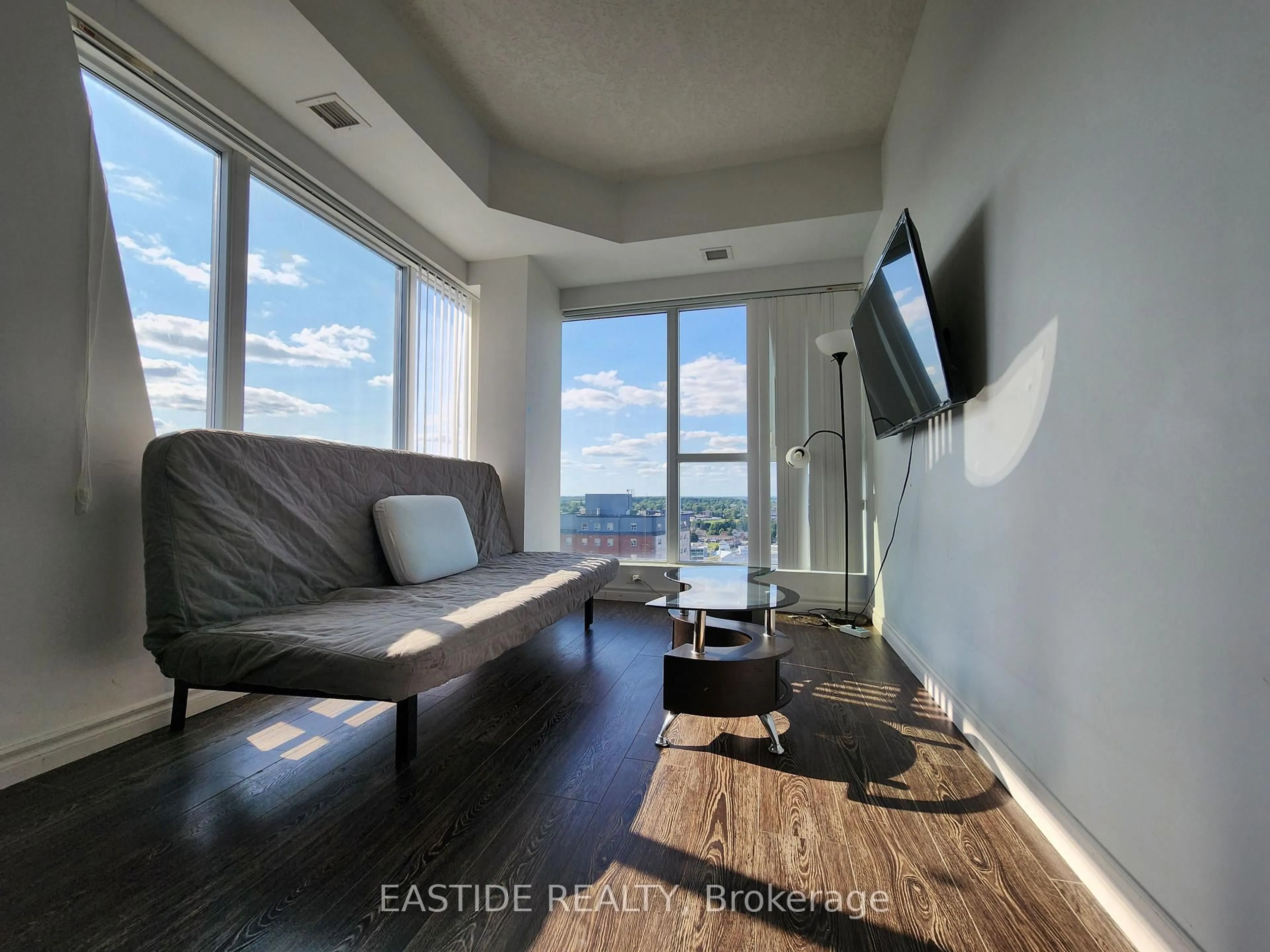 Living room with furniture, wood/laminate floor for 158 King St #1805, Waterloo Ontario N2J 2Y2