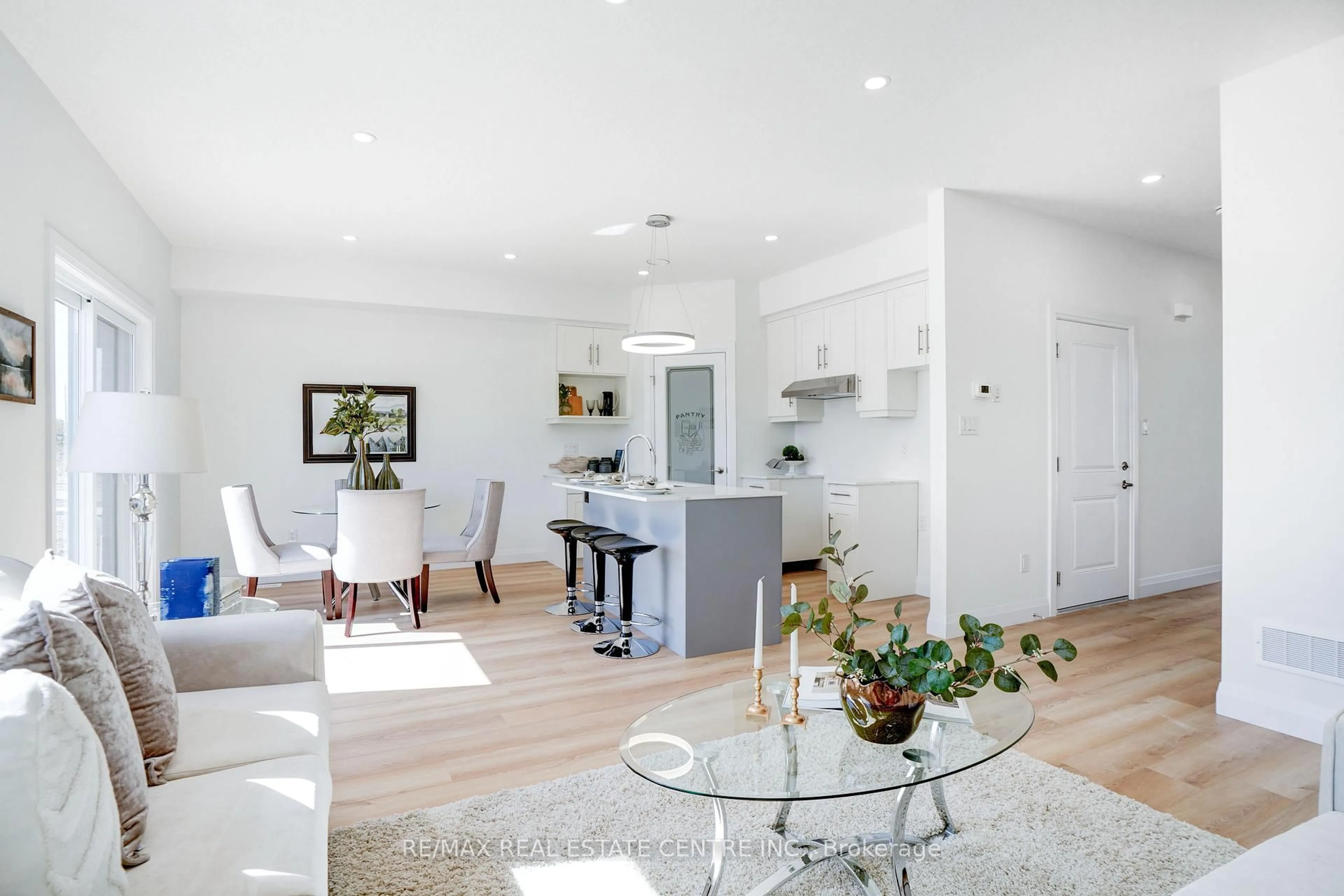 Living room with furniture, wood/laminate floor for 2568 Constance Ave, London South Ontario N6M 1E7