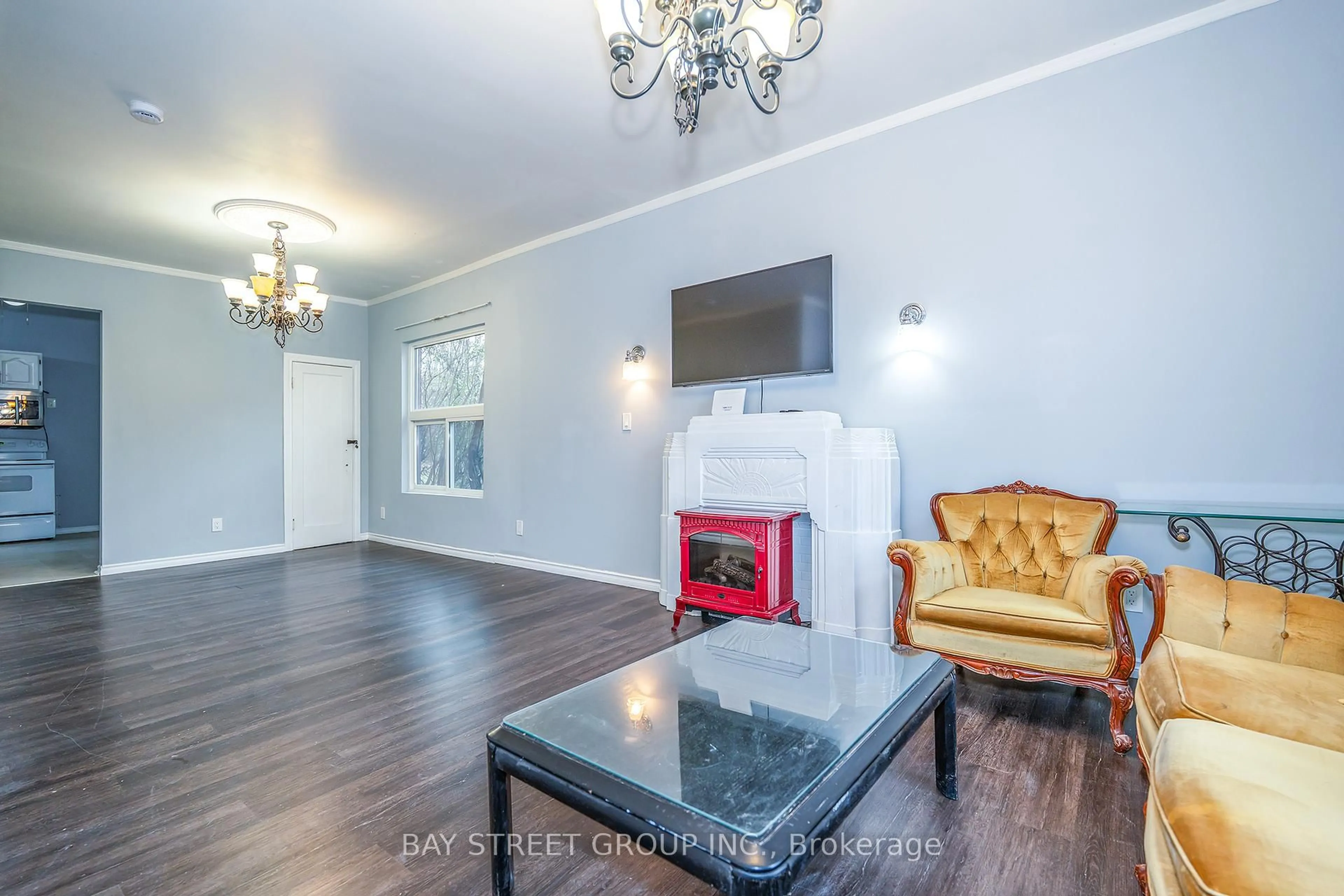 Living room with furniture, wood/laminate floor for 4308 Ellis St, Niagara Falls Ontario L2E 1H1