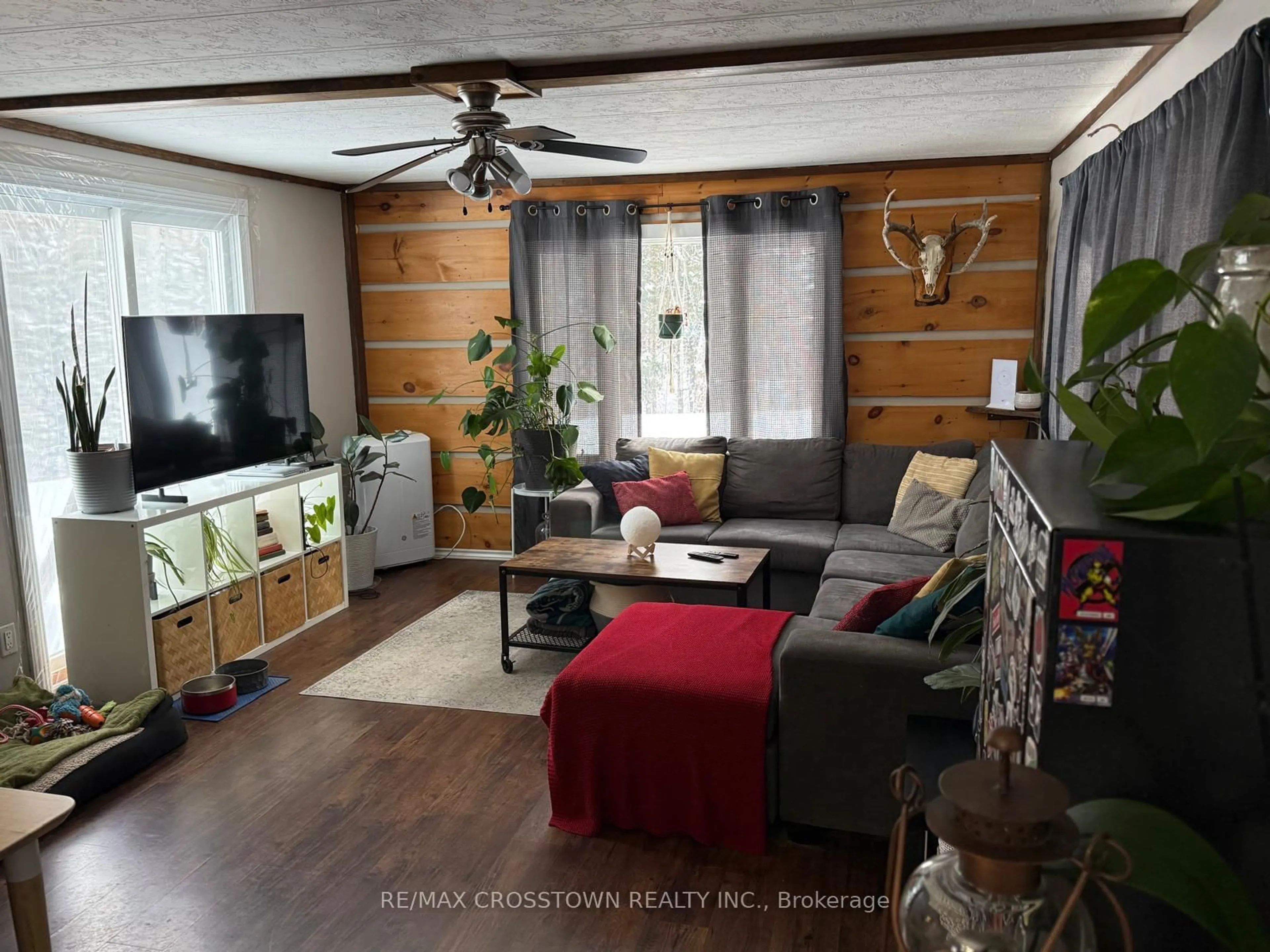 Living room with furniture, wood/laminate floor for 530 South Horn Lake Rd, Armour Ontario P0A 1C0