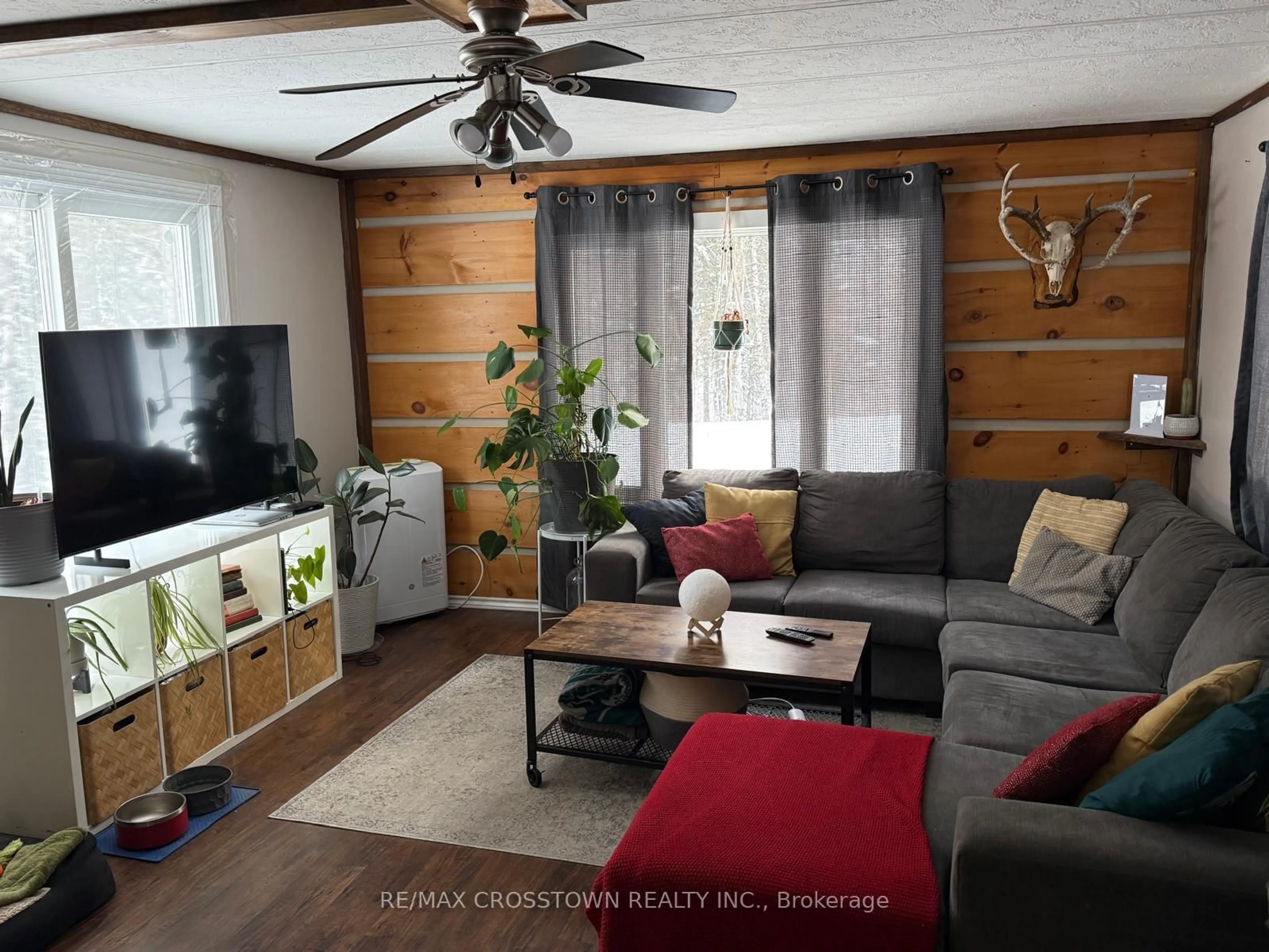 Living room with furniture, wood/laminate floor for 530 South Horn Lake Rd, Armour Ontario P0A 1C0