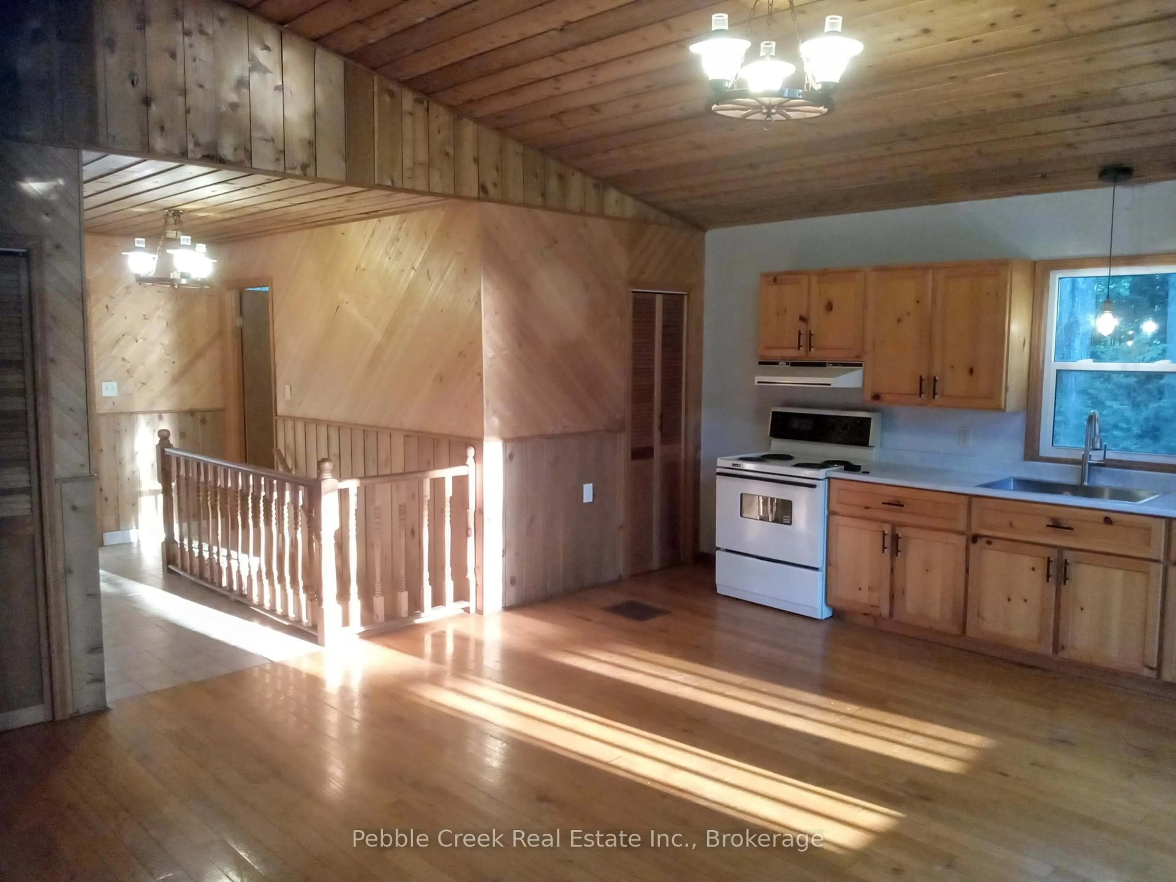 Open concept kitchen, wood/laminate floor for 84433 Sunrise Dr, Ashfield-Colborne-Wawanosh Ontario N7A 3X9