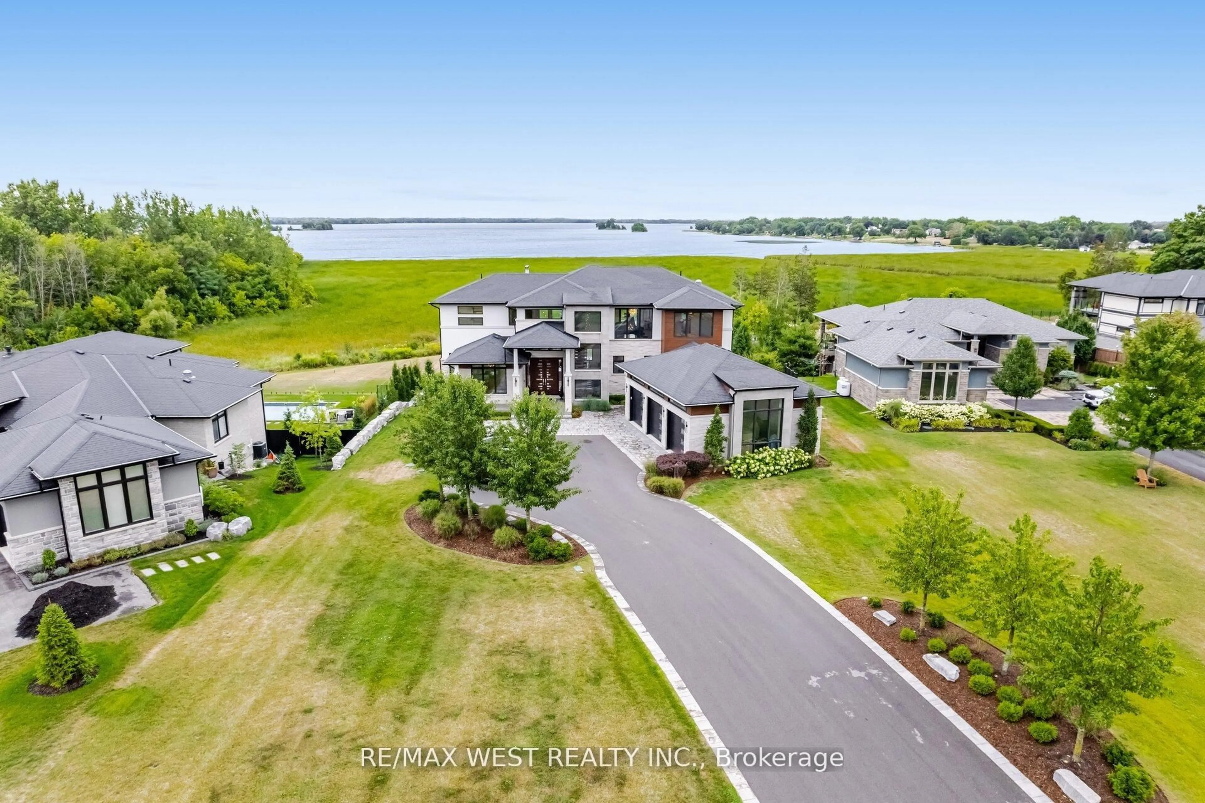 A pic from outside/outdoor area/front of a property/back of a property/a pic from drone, water/lake/river/ocean view for 83 Navigation Dr, Prince Edward County Ontario K8N 0G1