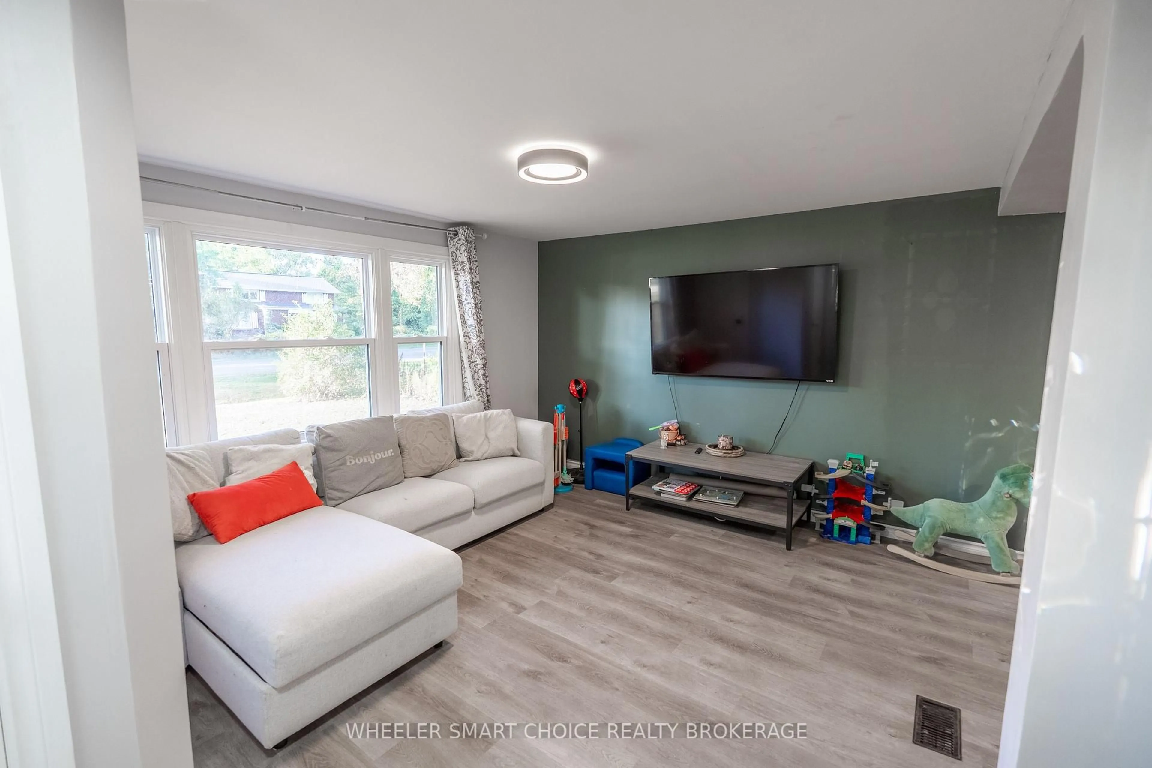 Living room with furniture, wood/laminate floor for 15904 Manning Rd, South Stormont Ontario K0C 1M0
