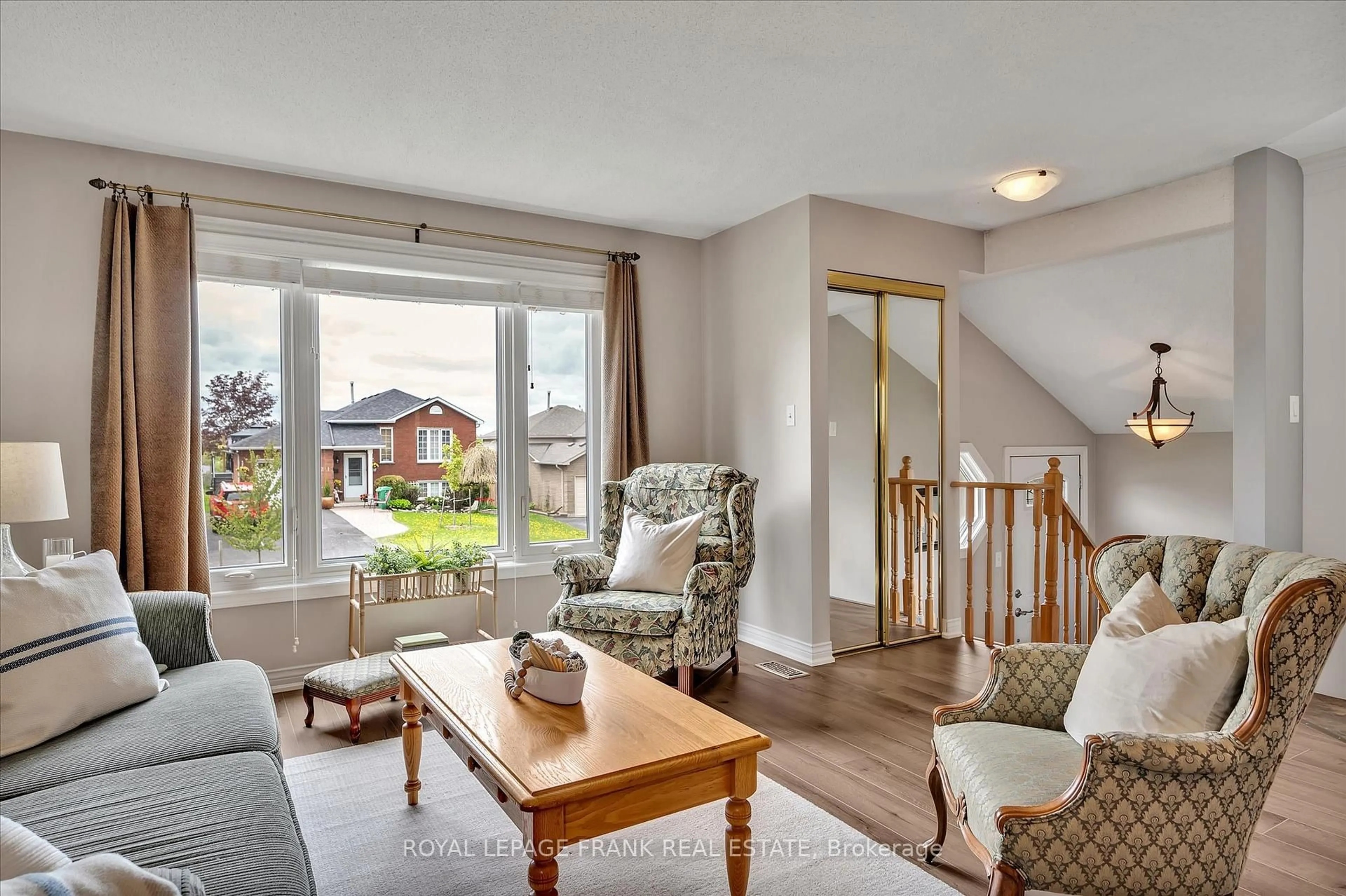 Living room with furniture, wood/laminate floor for 2114 Easthill Dr, Peterborough Ontario K9L 1Y8