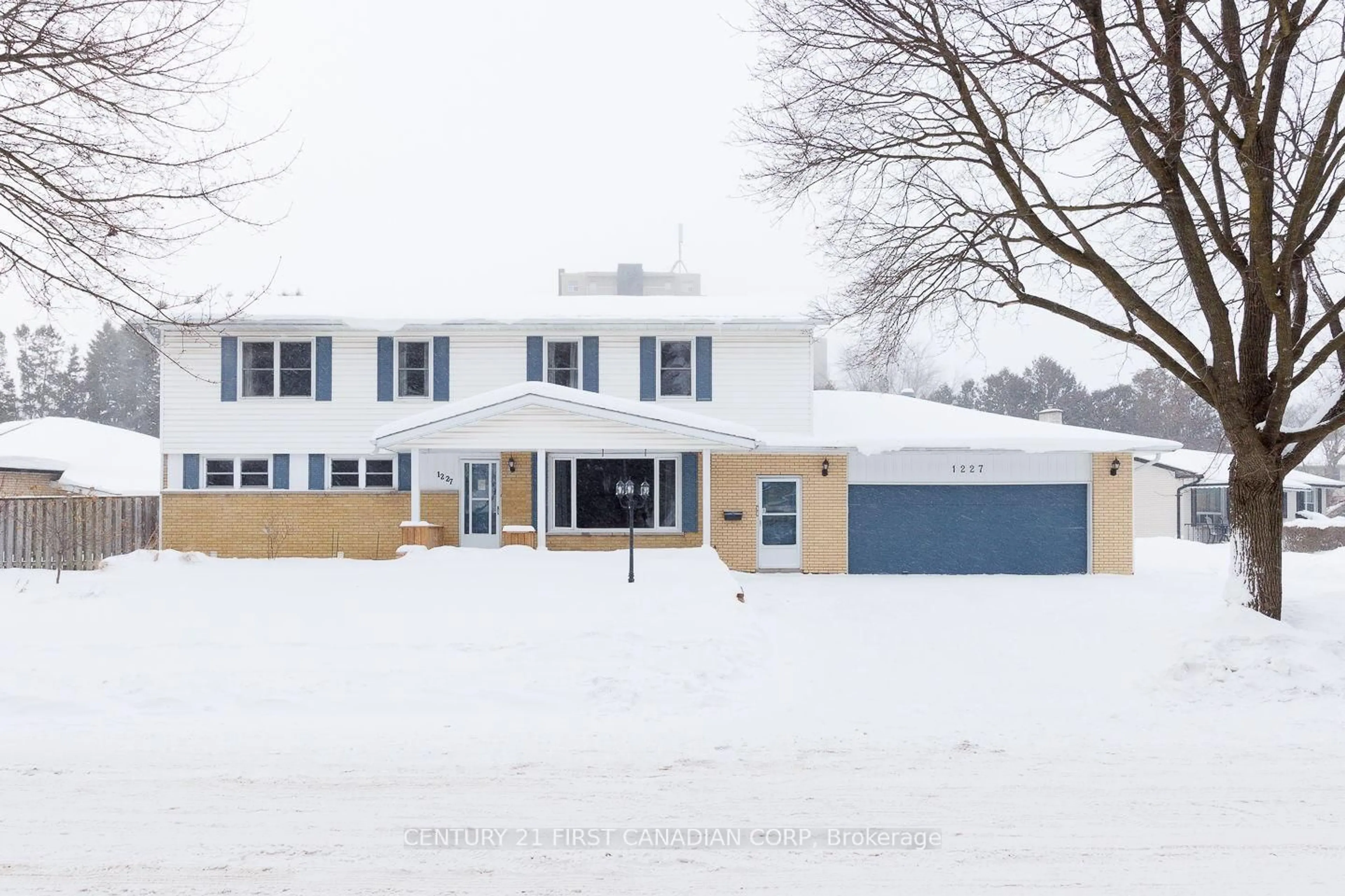 Home with vinyl exterior material, street for 1227 Victoria Dr, London East Ontario N5Y 4E3