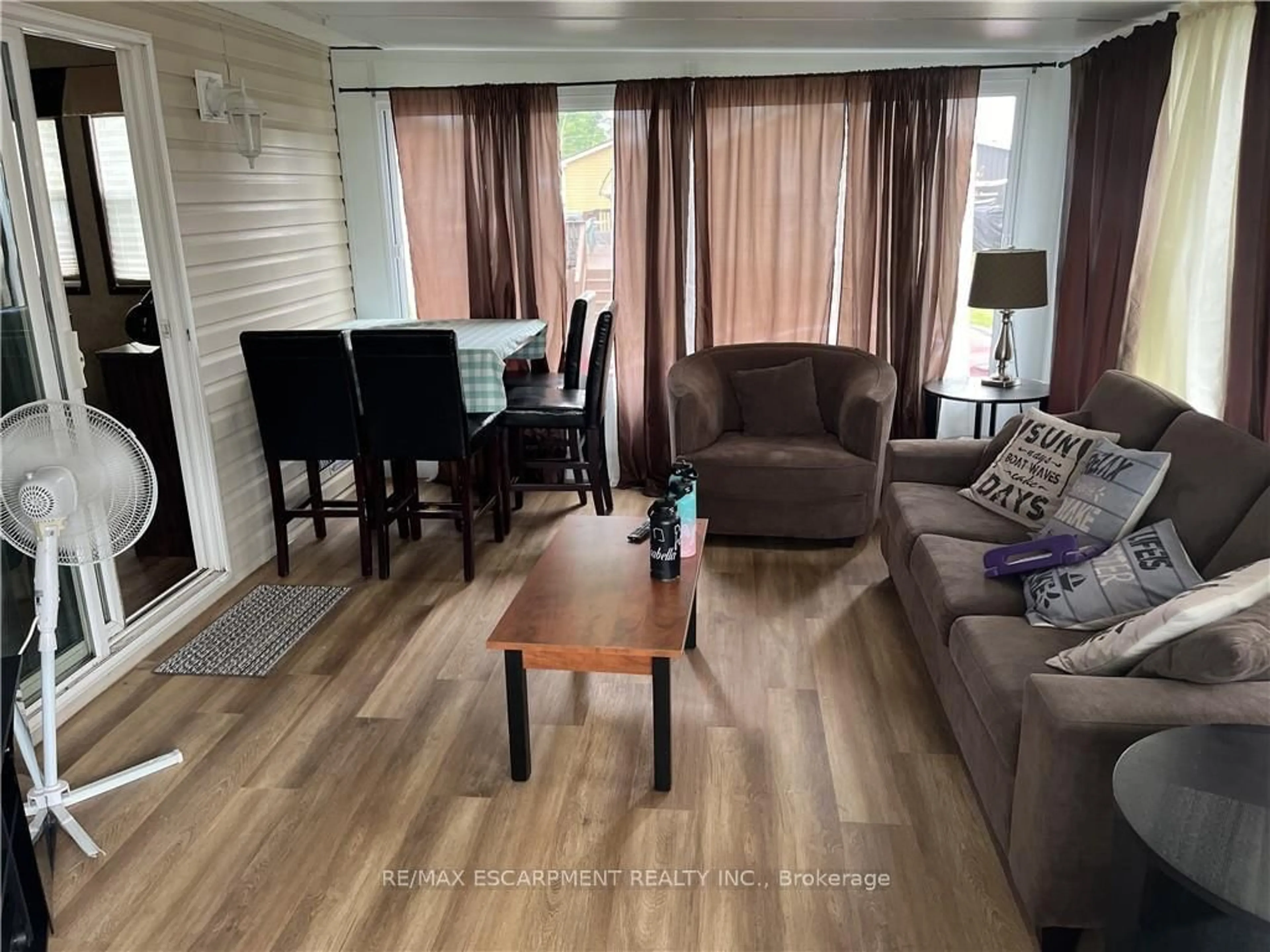 Living room with furniture, wood/laminate floor for 45 Quarry View Village, Port Colborne Ontario L0S 1R0
