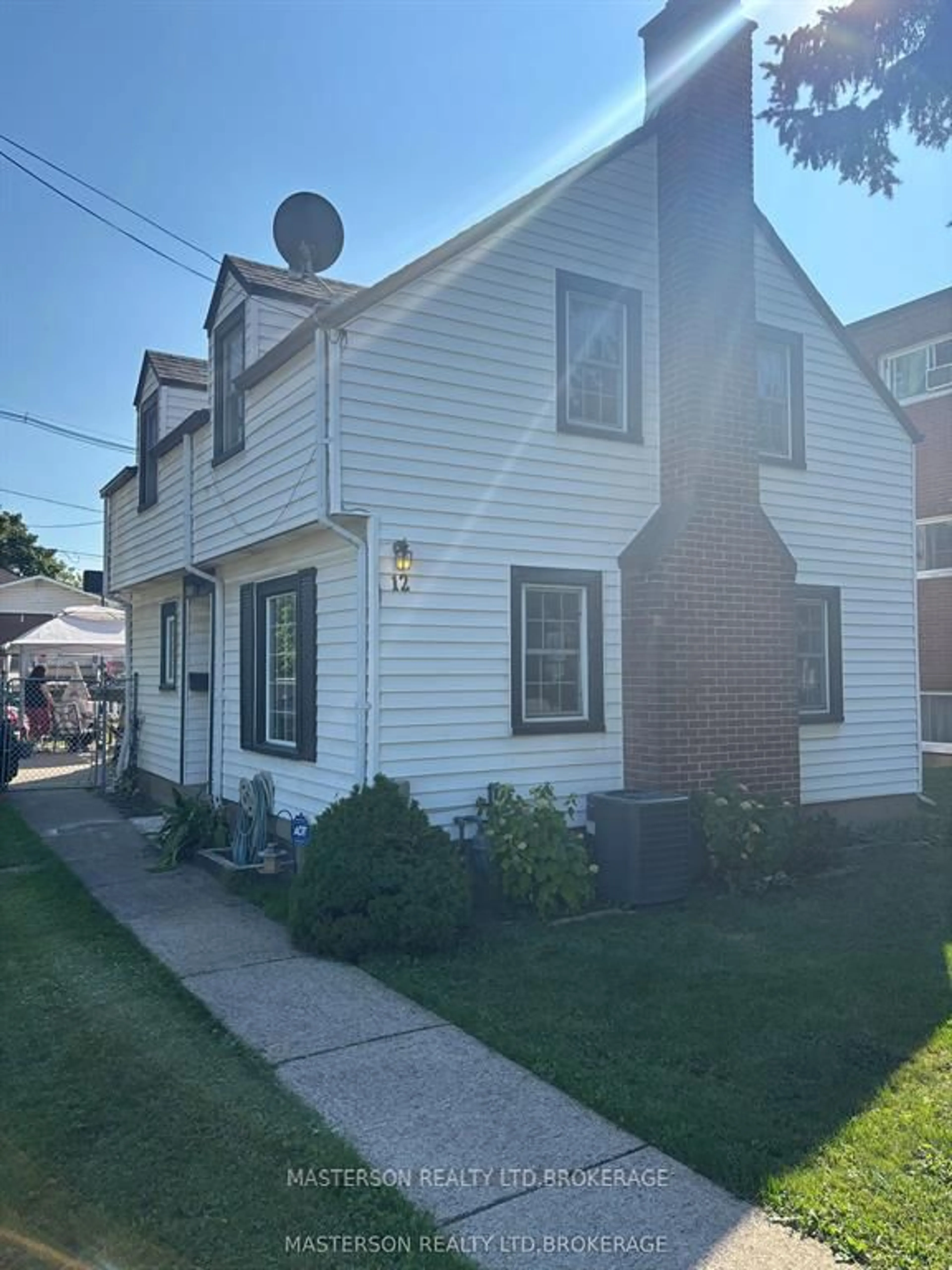 Home with vinyl exterior material, street for 12 Chestnut St, St. Catharines Ontario L2T 1G5